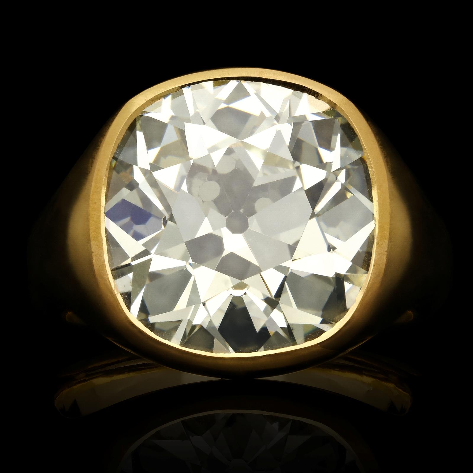 Spectacular 22ct yellow gold and old-cut diamond gypsy-set ring by Hancocks, set flush to the centre with a wonderfully bright and lively old mine cushion cut diamond weighing 15.80ct within a beautifully hand-crafted mount of rich 22ct yellow gold