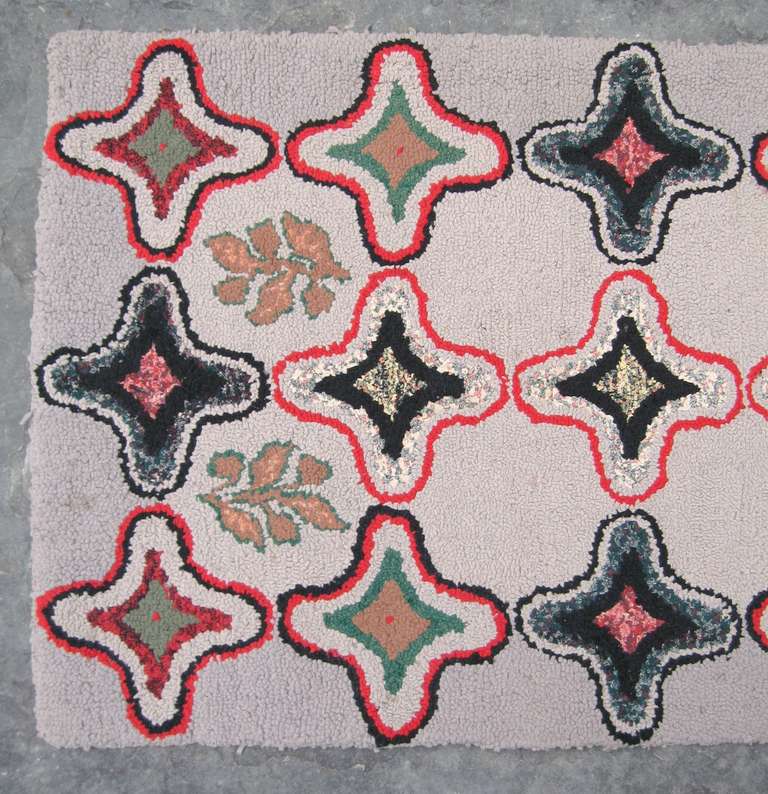 This is a spectacular 1920s, geometric vintage American Folk Art hook rug. It has a very unique pattern and color scheme. A great piece of Americana. Be sure to check our storefront for many more decorating ideas, from primitives, Machine age,