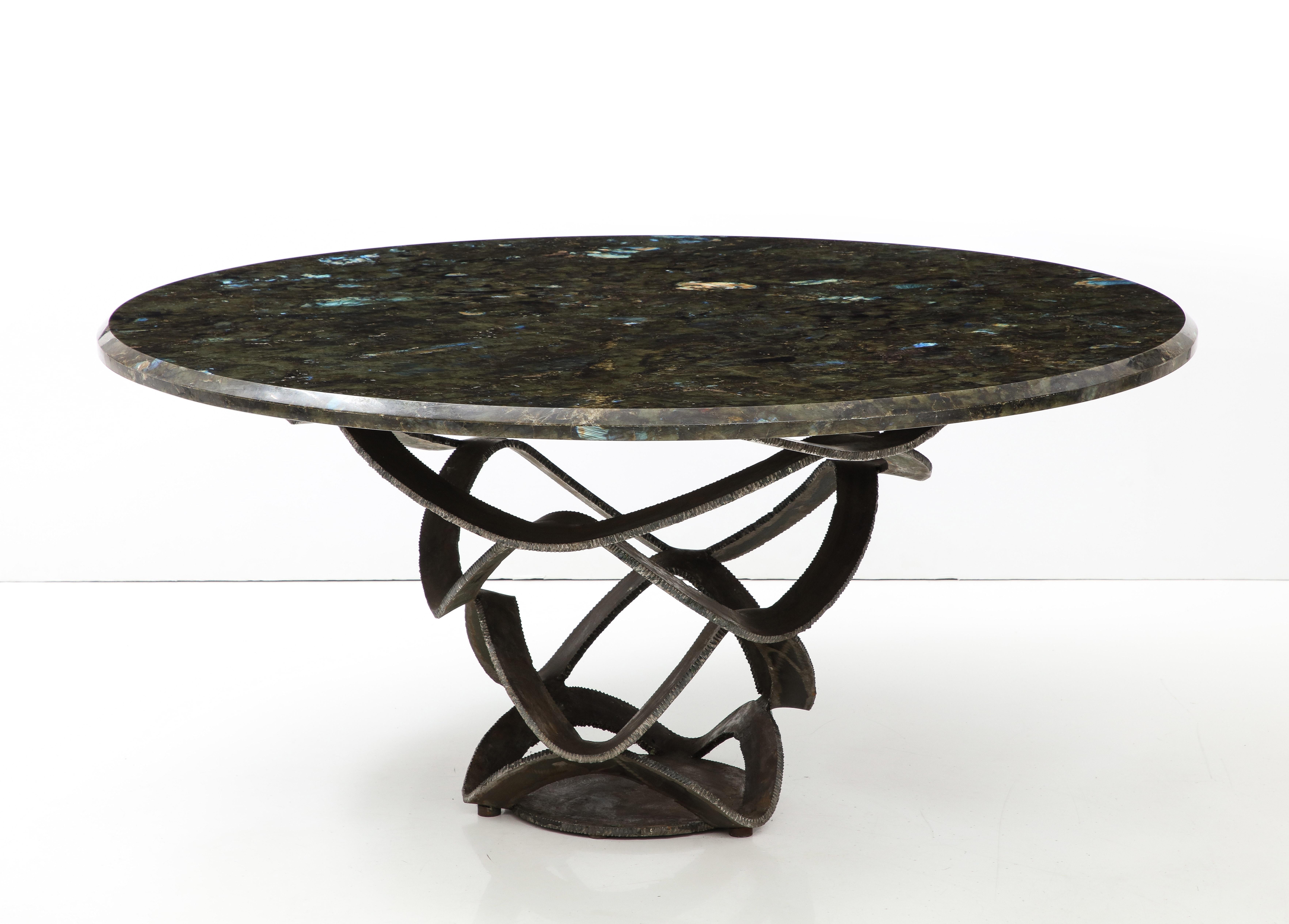 Spectacular 1970's Dining / Center Table.
The Stunning  Sculptural forged steel base supports the Wonderful Labradorite 
bevelled edge stone top.
The colors in the stone are forever changing from the light.  