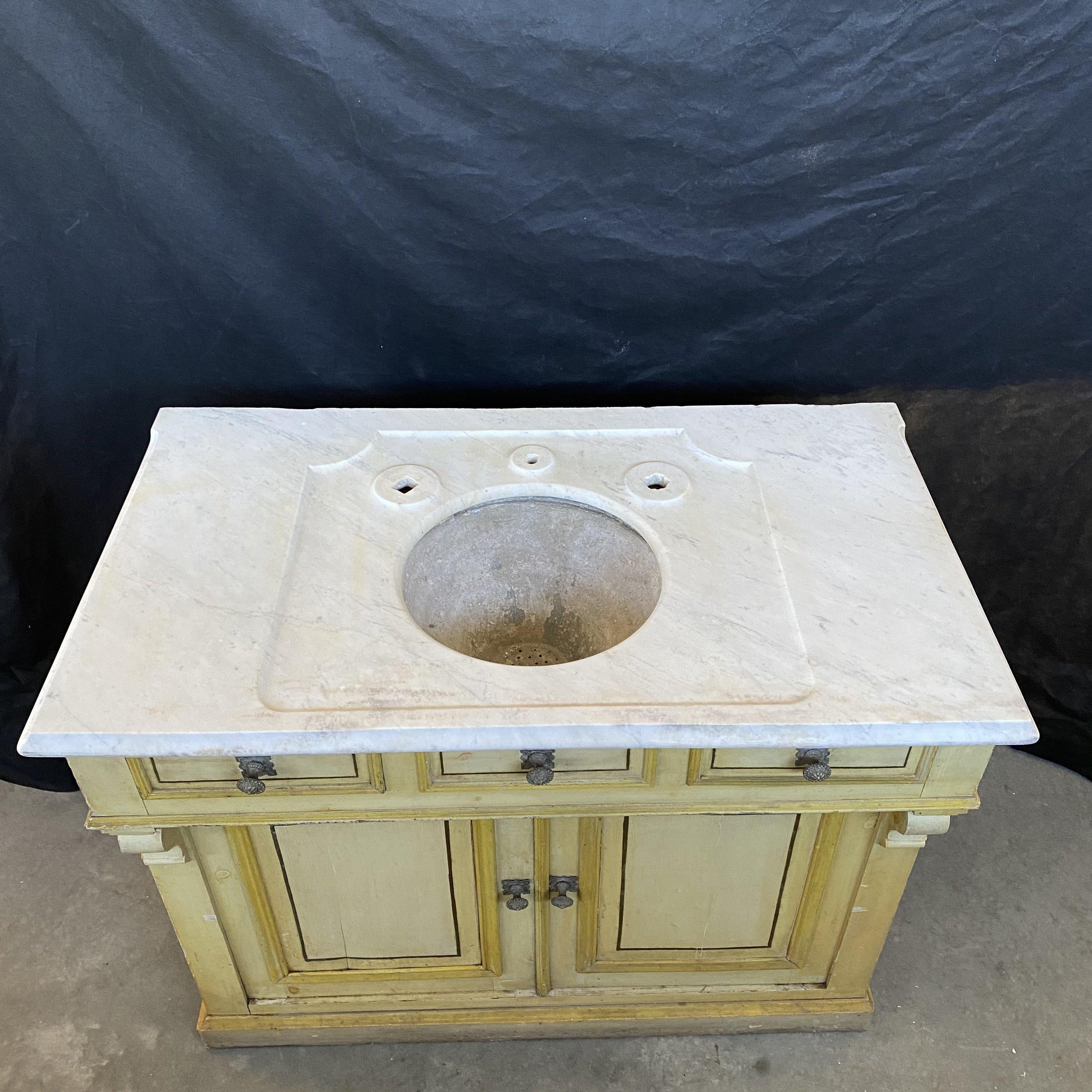 Really beautiful and classic French painting on this one-of-a-kind 19th century French marble countertop sink cabinet with classic French yellow original paint and zinc sink bowl. Two of the three drawers on top open (center is a faux drawer