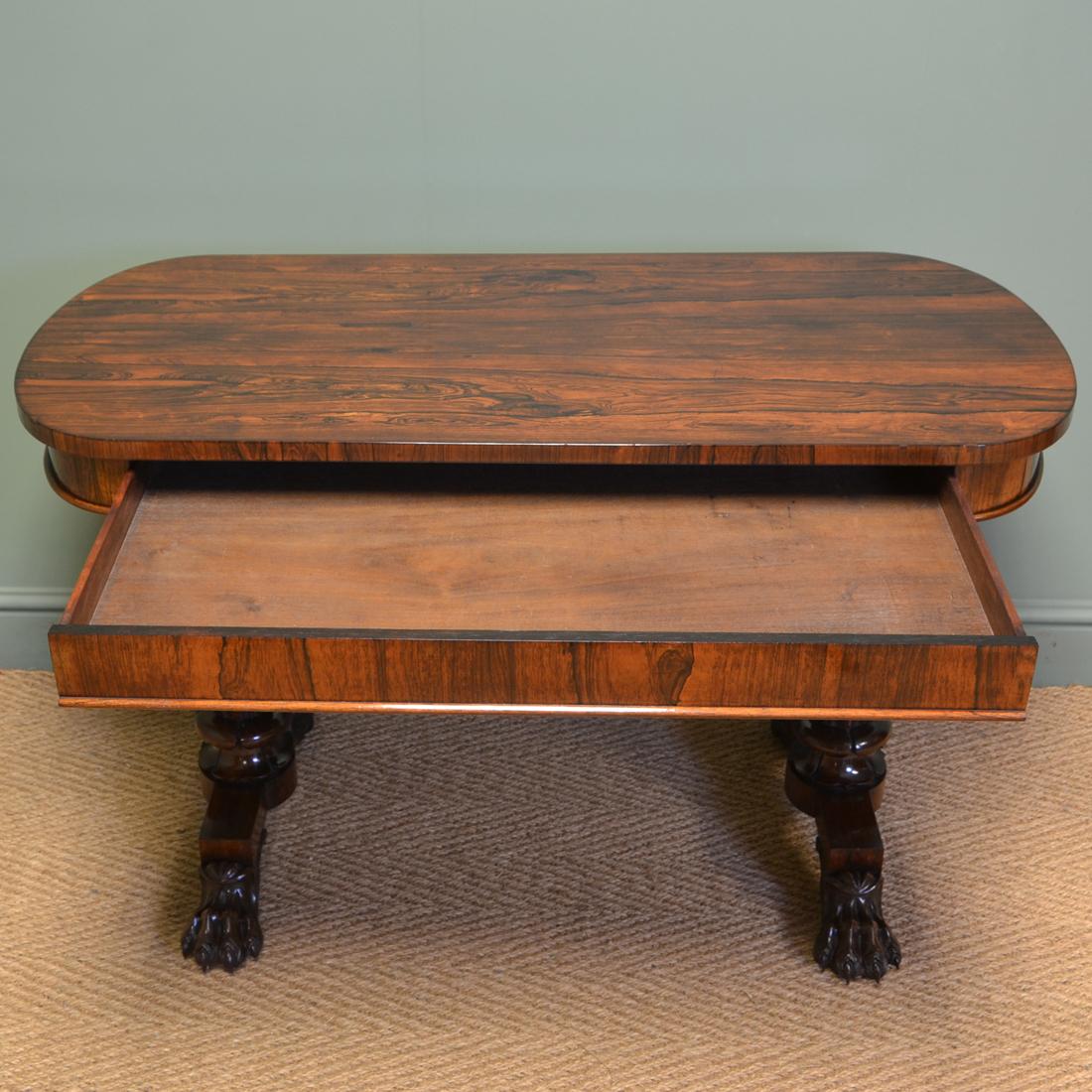 Spectacular William IV figured rosewood antique writing table

With the most spectacular figured top above a frieze with mahogany lined frieze drawer this quality antique writing table dates from circa 1835. It stands on an elegant carved pedestal
