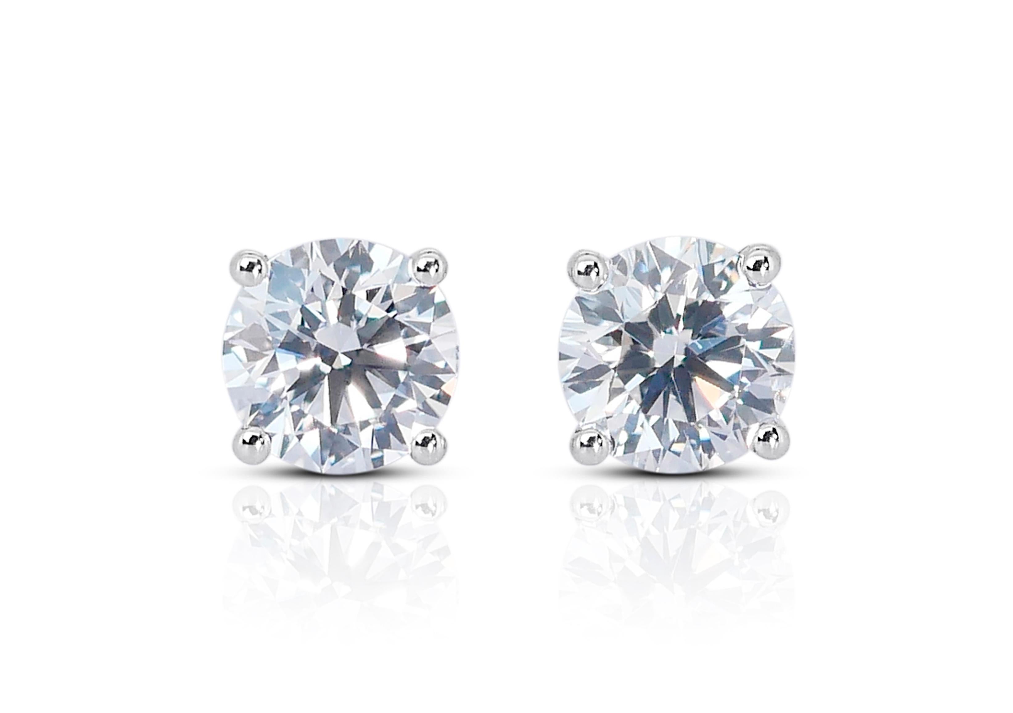 Spectacular 2.06ct Diamond Stud Earrings in 18k White Gold - GIA Certified

Elevate your elegance with these exceptional diamond stud earrings, masterfully crafted from 18k white gold. Each earring is set with a brilliant round diamond, together