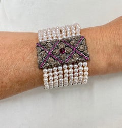 Spectacular 9-Row Pearl Bracelet in White Gold with Diamonds and Pink Sapphire