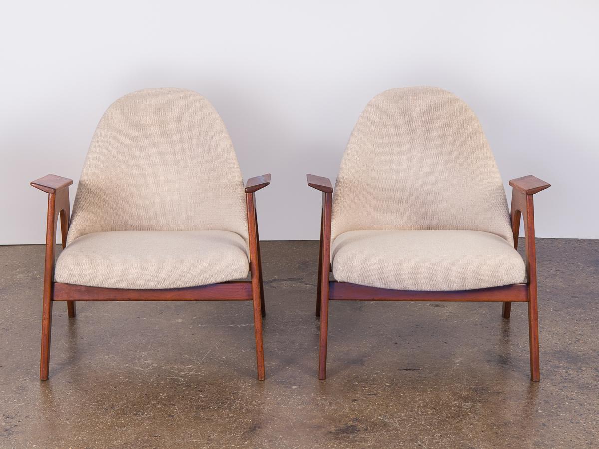 Spectacular American walnut armchairs in the style of Adrian Pearsall. Architectural, unusual design form. In excellent condition. No expense was spared in the restoration of these chairs. New, creamy Knoll fabric upholstery is soft and sumptuous.