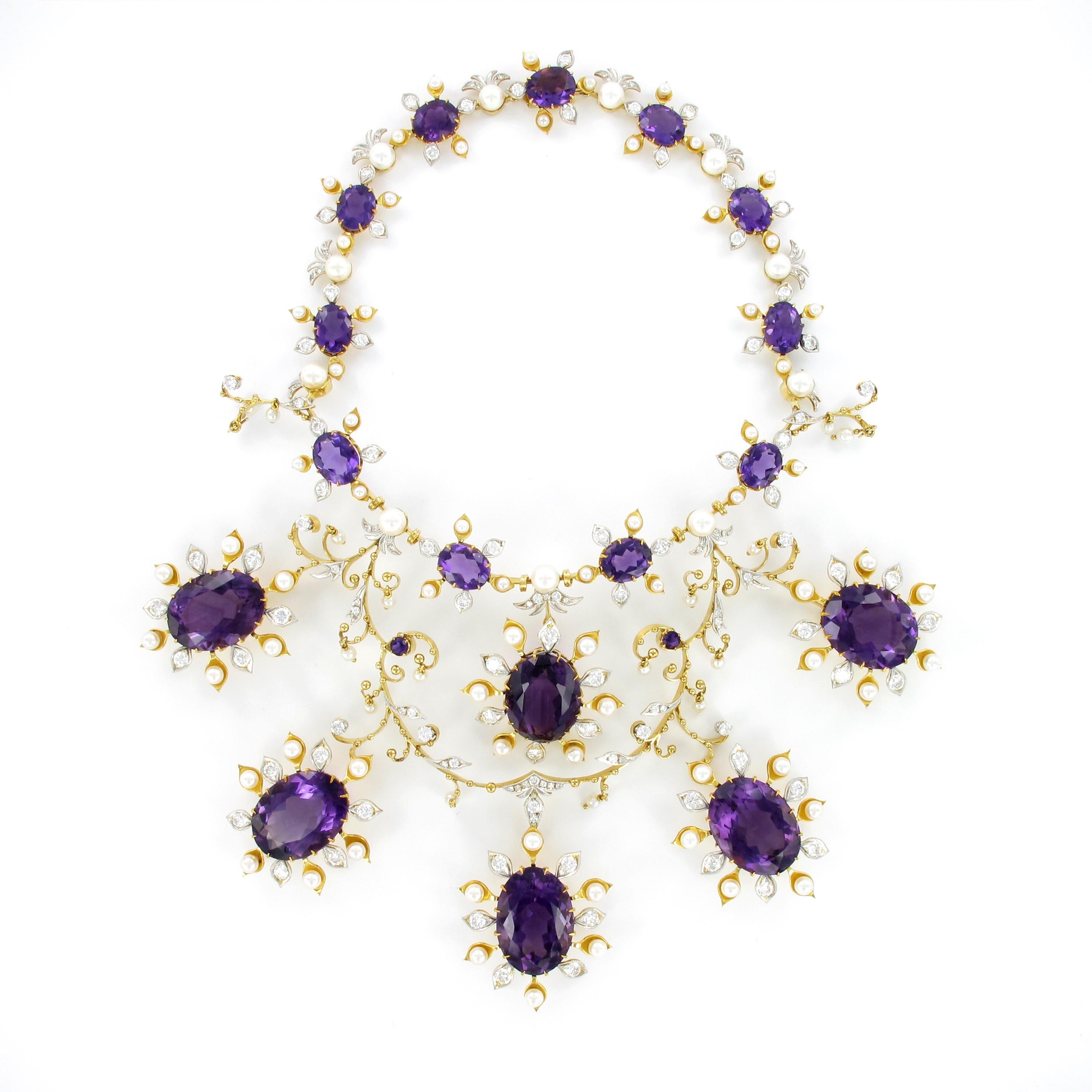 What a show! Spectacular amethyst, diamond and pearl suite consisting of necklace, ear hangers, ring, bangle and brooch. Flowery design in 18 Karat yellow and white gold.

Prong set with a total of 26 oval and round shaped amethysts totaling an