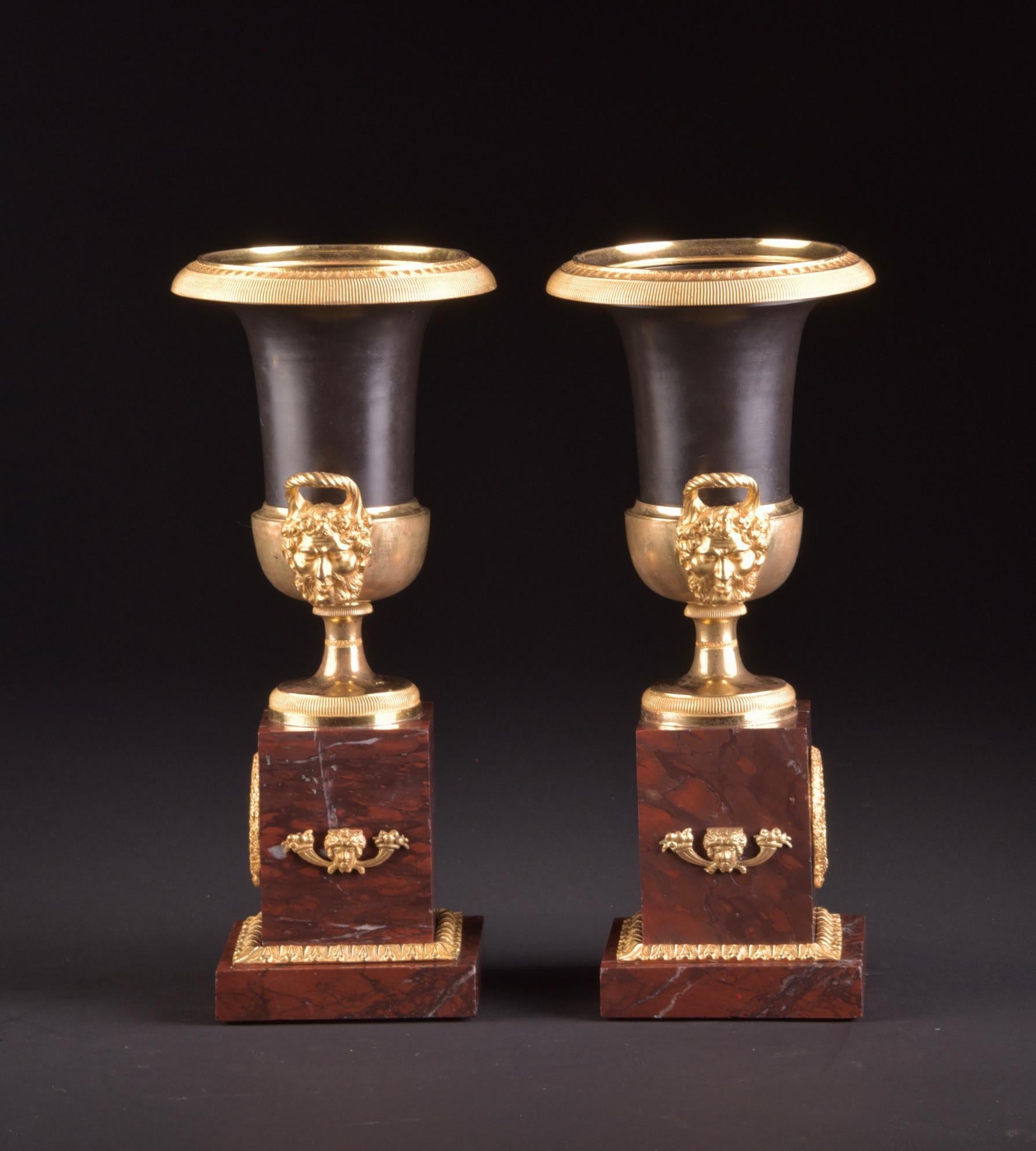 Antique French bronze and marble cassolettes or Medici vases, with gilt and patinated bronze on marble base.
The vases are 33 x 15 x 15 cm, and weights 4,4 kg each.
  