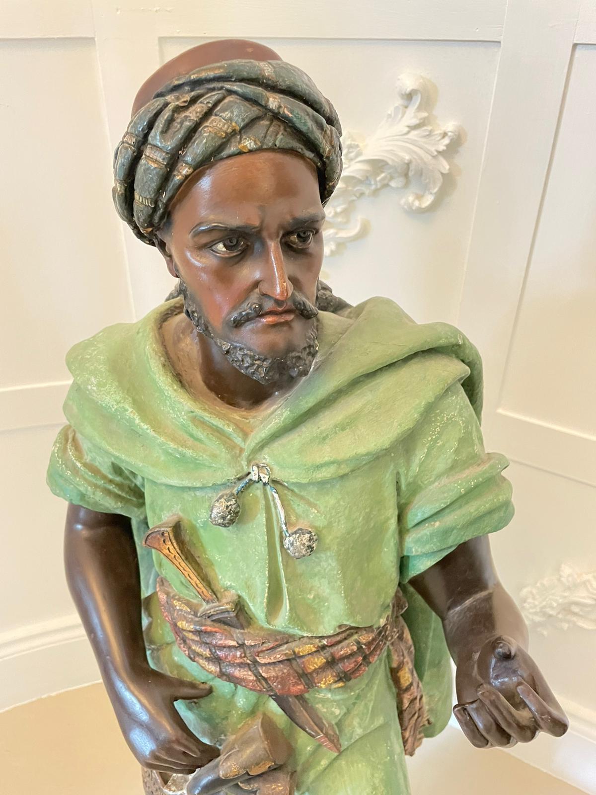 Spectacular pair of large antique quality orientalist polychromed plaster Arabesque or Moorish figures 
depicting two males in traditional moorish robes and headdress with artfully shaped hands. These amazing plaster figures with a polychromed