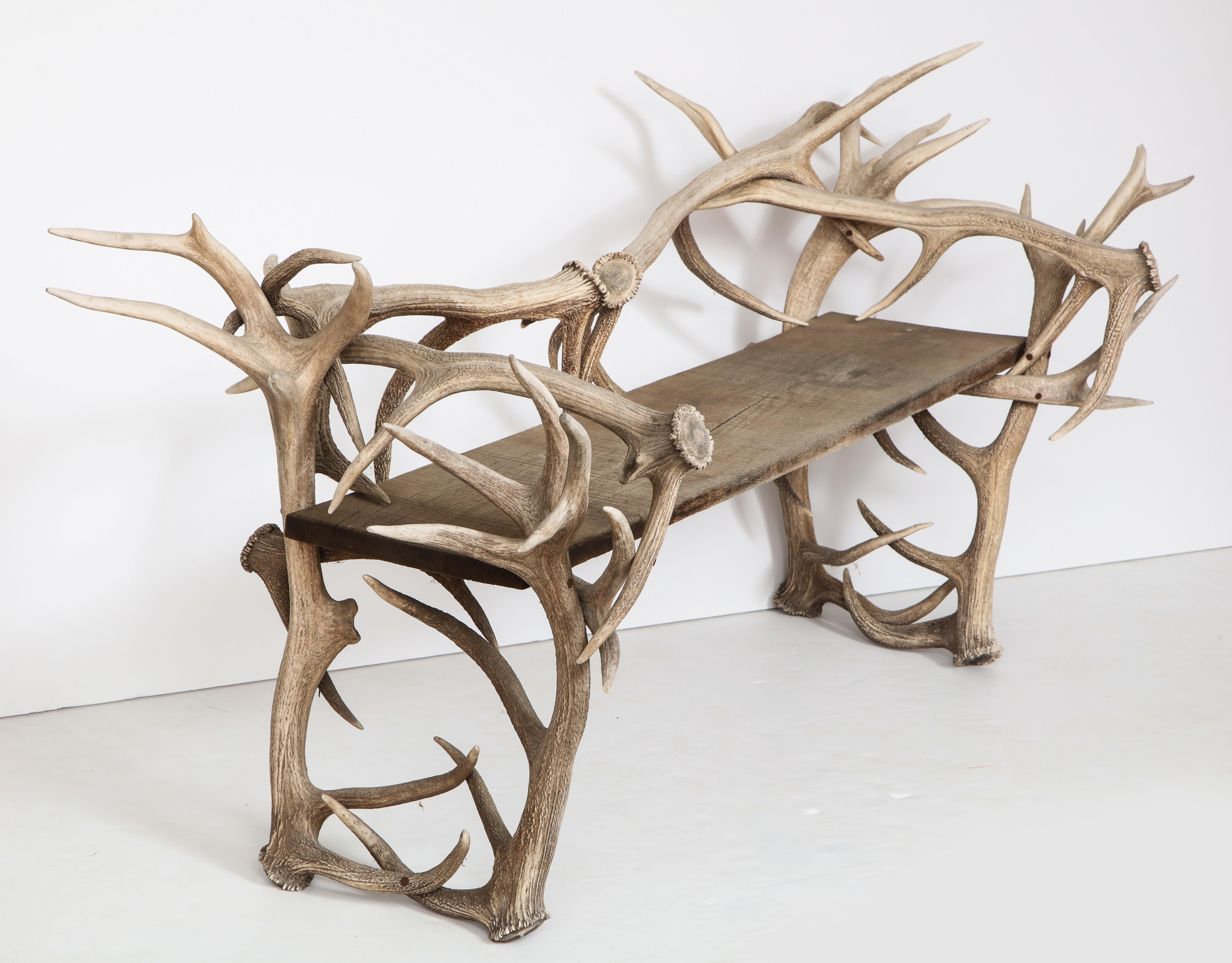 Spectacular Antler chair or bench.
Beautifully crafted chair or bench of Antlers with a rustic wooden seat.