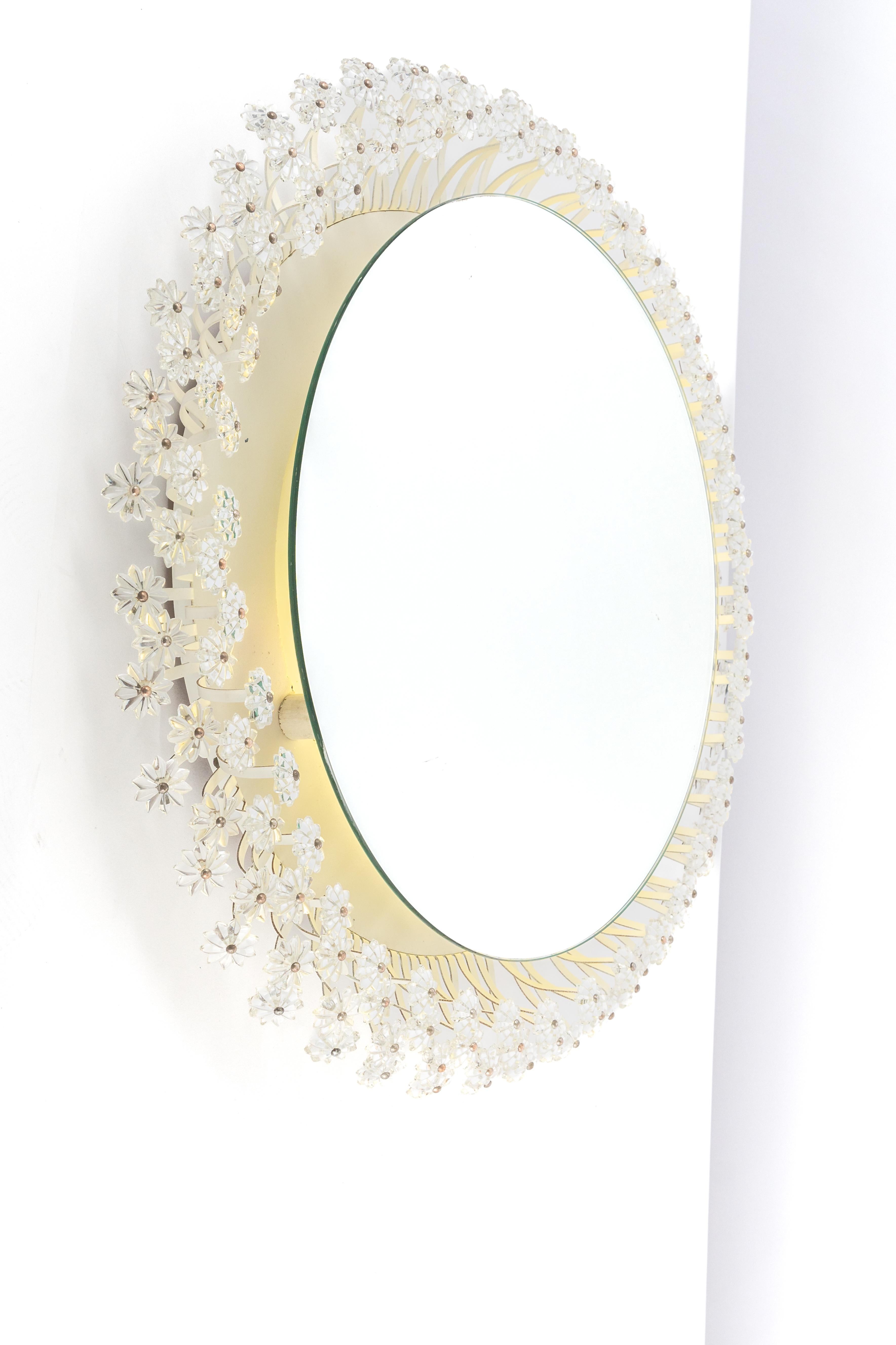 A wonderful and high quality wall mirror by Emil Stejnar, Germany, 1970s
It is made of a metal frame decorated with hundreds of cut crystal glass. 

High quality and in very good condition. Cleaned, well-wired, and ready to use. 
The mirror can be
