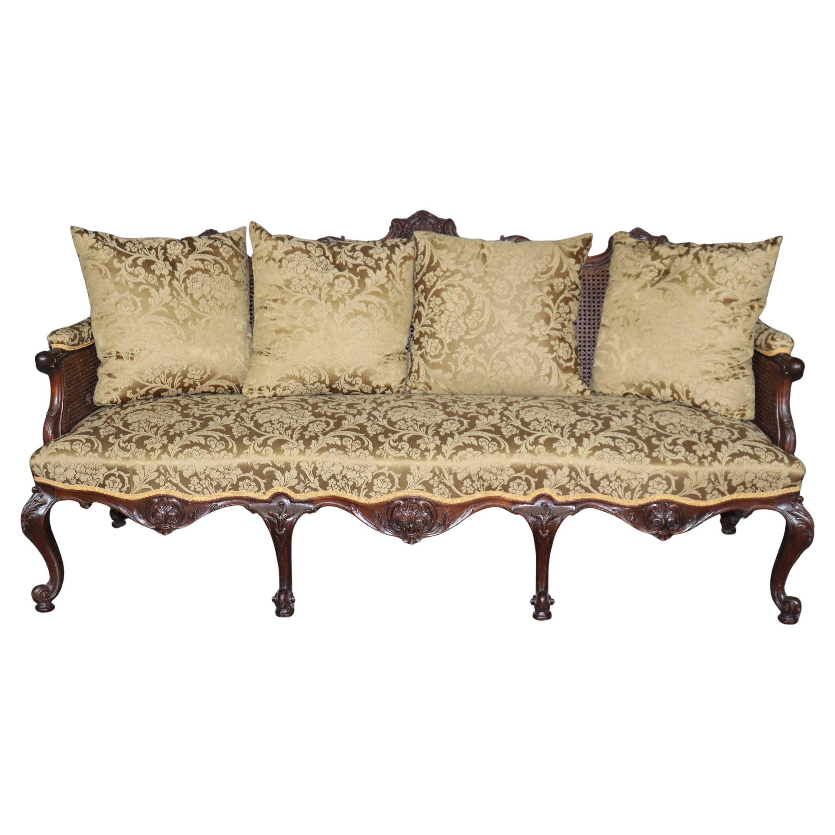 Spectacular Carved Mahogany Cane and Damask Upholstered English Georgian Sofa