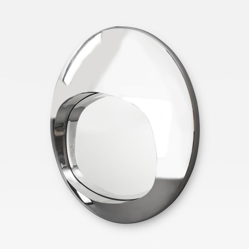 FRANCE, 1970's
Spectacular Futuristic mirror
Convex chromed metal with a deep asymmetrical reveal, mirrored glass with wide bevel
Dimensions: 39 Diameter x 6 Deep
This mirror is highly reflective and difficult to photograph, the shape of the piece