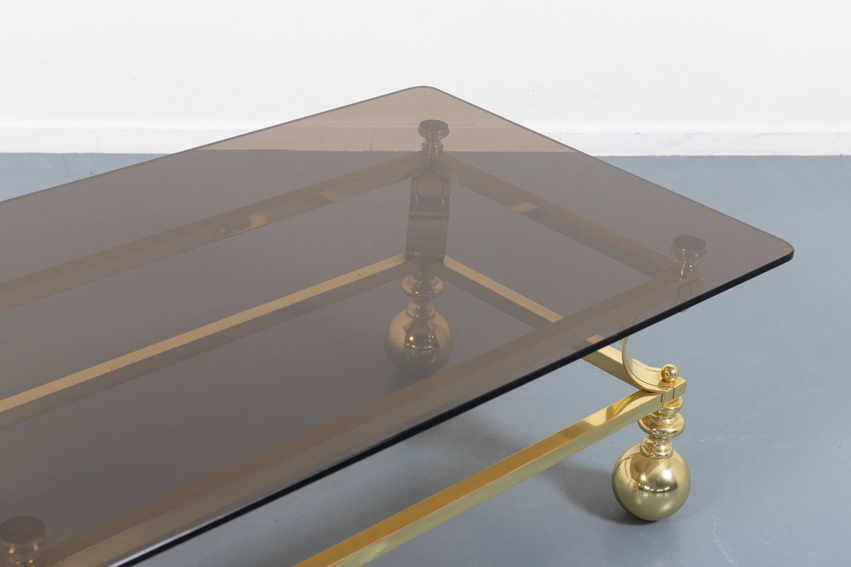 Impressive rare coffee table from 1970’s with sculptural gold colour steel frame and loose smoked glass top designed by Marzio Cecchi.

Condition
Good.

Dimensions
width: 70 cm
length: 120 cm
height: 43 cm