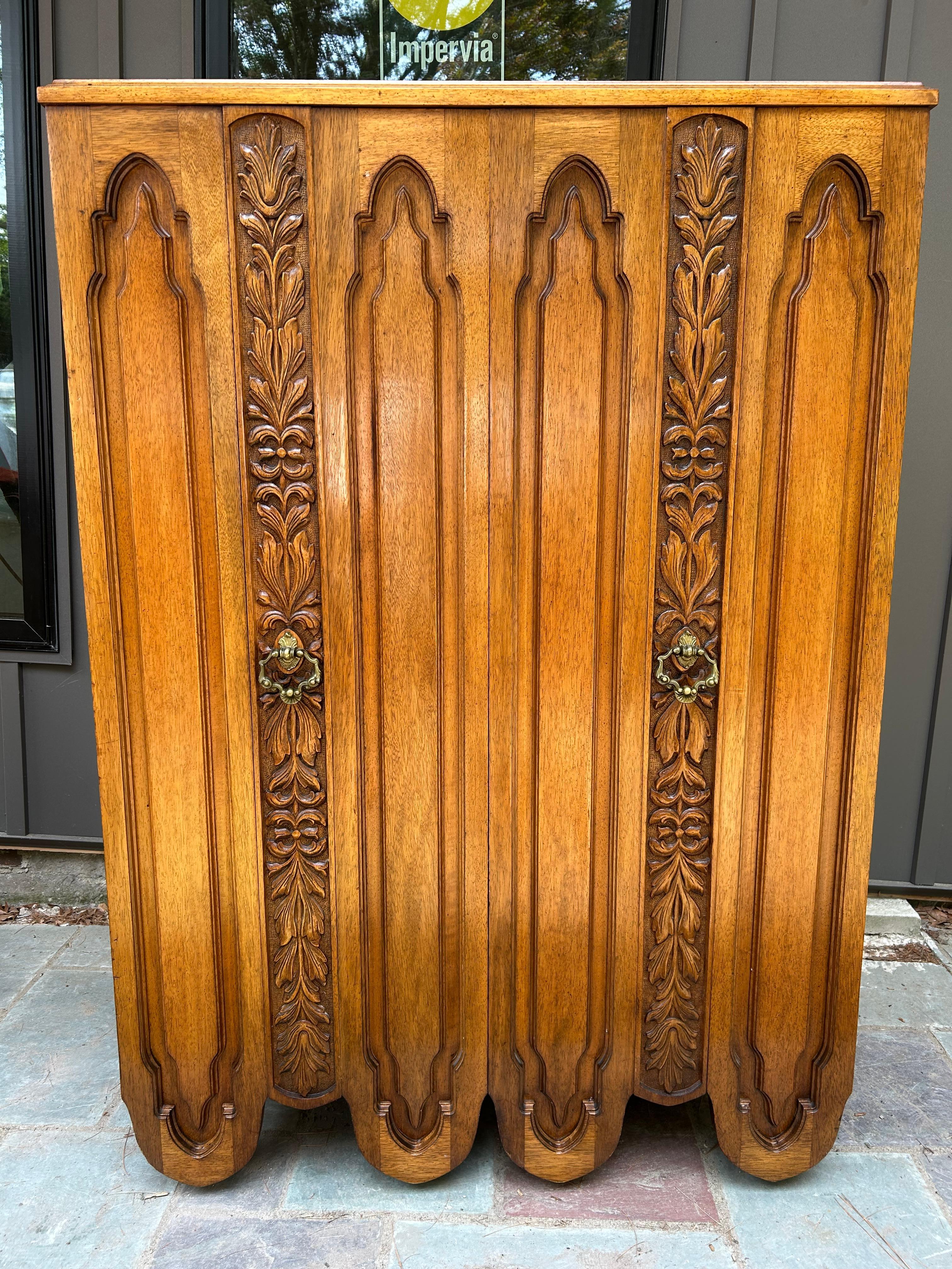 Spectacular Daniel Jones Inc. Spanish Revival 6 Drawer walnut tall dresser.  This is one of those rare pieces that stops you in your tracks-so unique!  I just love the quality and craftsmanship of this piece-they surely don't make furniture like