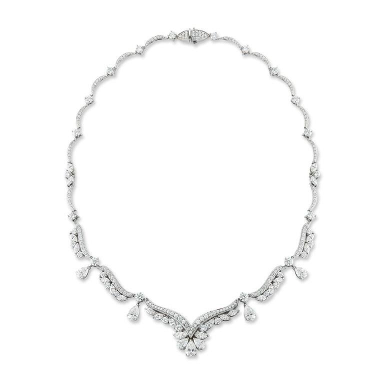 SPECTACULAR DIAMOND NECKLACE A cascading arrangement of bright dazzling pear and marquis shaped diamonds will form a luxurious drape over any collarbone Item: # 03170 Metal: 18k W Diamond Weight: 14.86 ct.
