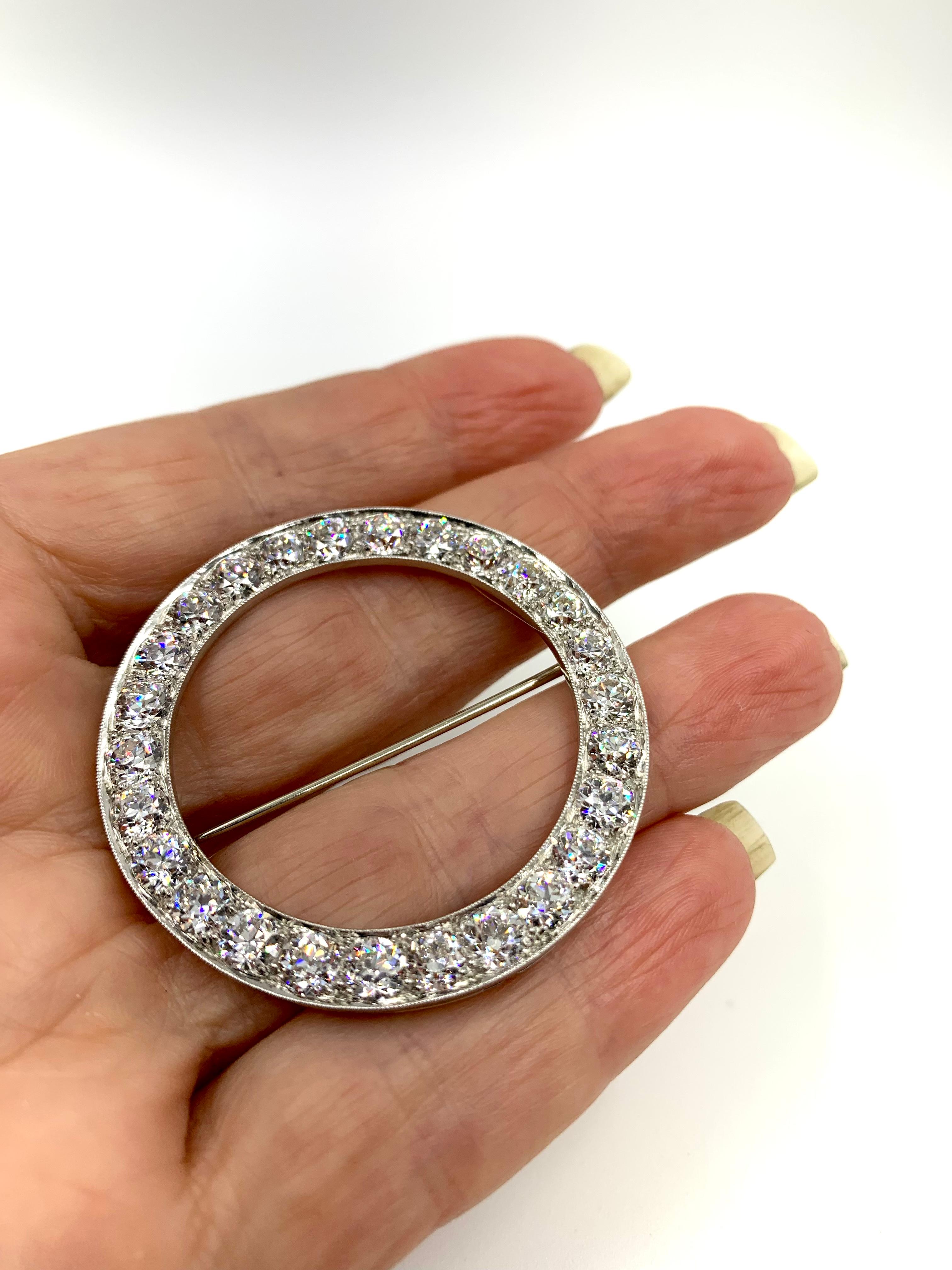 There are circle brooches and then there are spectacular circle brooches- this one is the latter. 
Superb quality, composed of 26 excellent quality Old European cut diamonds for a total of 8.45 carats, F-G color, VVS1-VVS2 clarity, set in a fine