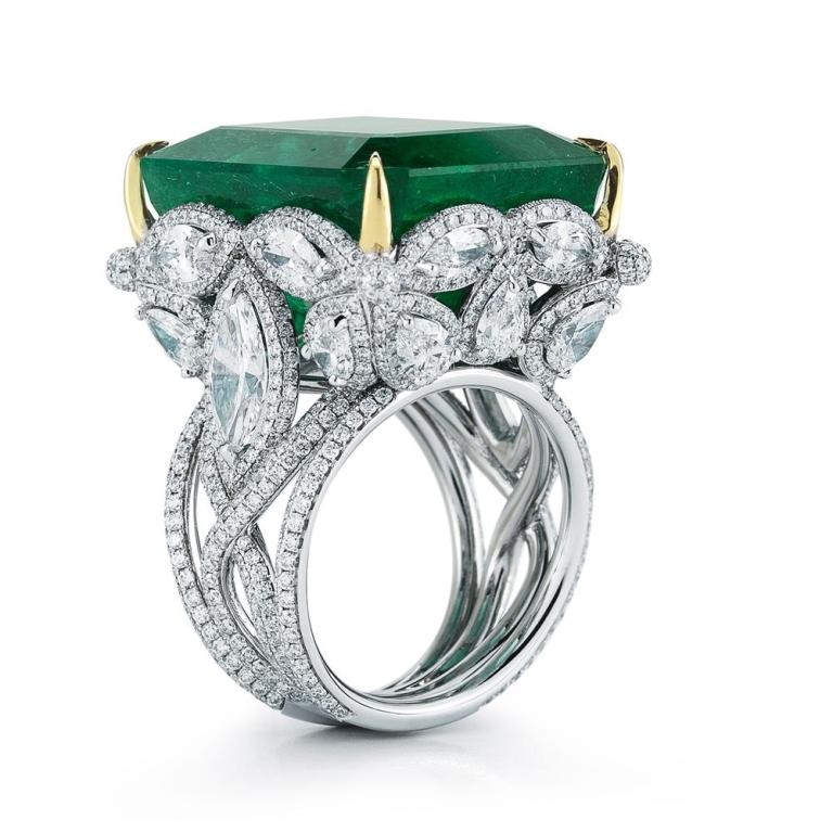 SPECTACULAR EMERALD AND DIAMOND RING A cluster of certified pear and marquis shaped diamonds forms a spectacular crown on top of which a behemoth 36 ct Majestic Emerald sits gorgeously. Item: # 02165 Metal: 18k W / Y Lab: Gia Color Weight: 36.35 ct.