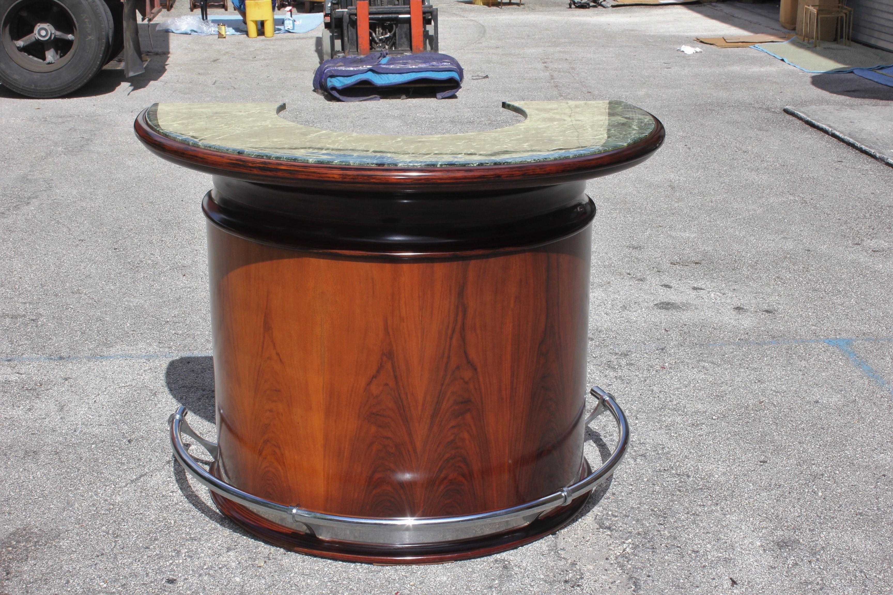 Monumental French Art Deco Macassar ebony semicircle dry bar marble top, circa 1940s. Very nice green color of the marble top ,with the chrome stole foot ,the dry bar are in perfect condition ,beautiful bar were anyone can good time with some