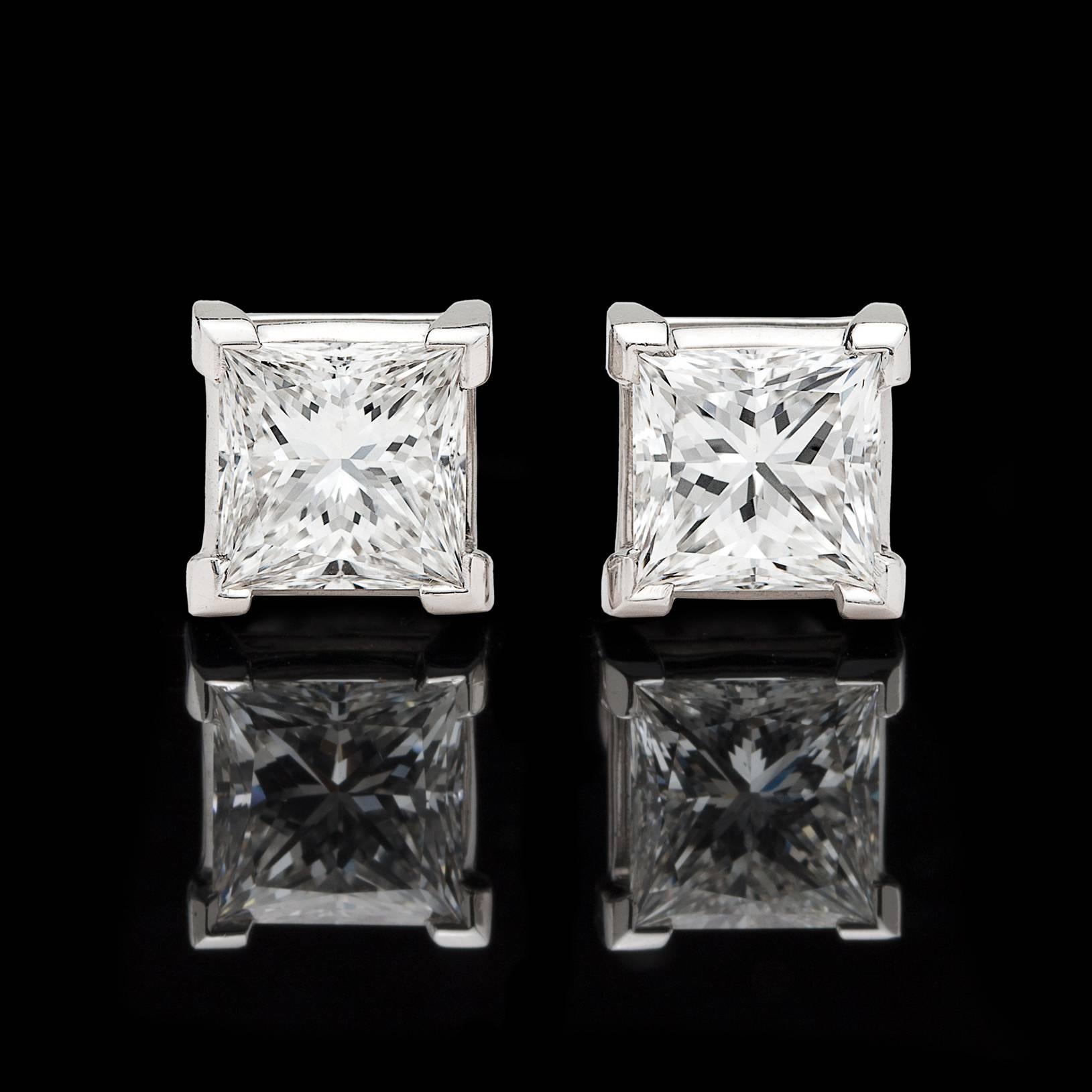 The perfect pair of earrings that can be worn day or night! At 2.54 carats total weight (1.21ct & 1.33ct) they are significant in size, and at F color and VS1 clarity, they are of exceptional quality. With incredible sparkle and fire, these two