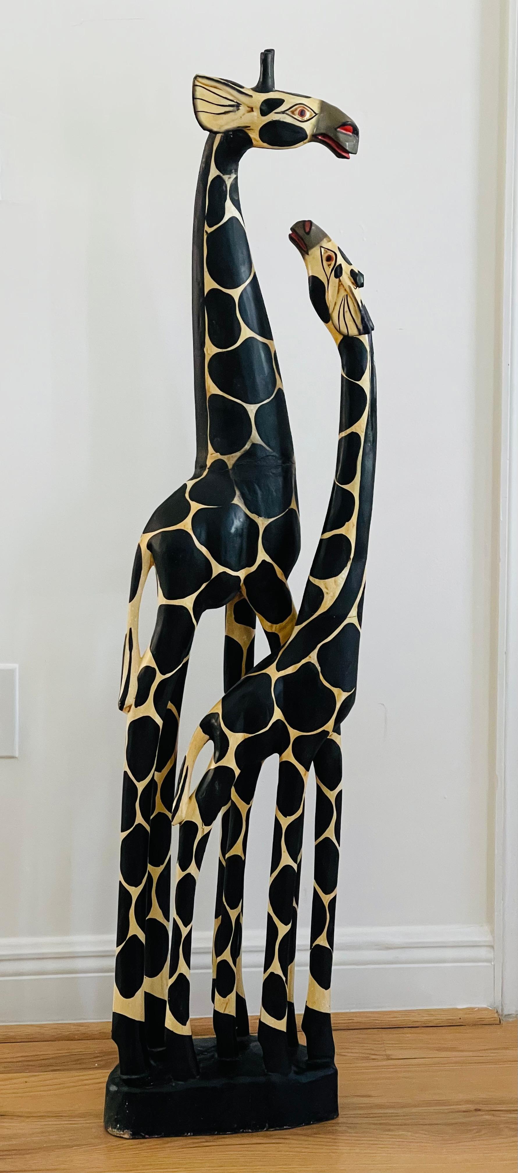 Spectacular giraffe couple sculpture handcarved, handcarved wood handpainted. Elegant unique stylization and colour. Some surface imperfections due to age .