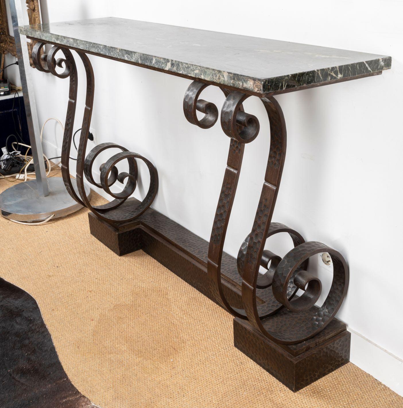 Spectacular Hammered Wroughtiron Art Deco Console Table, attributed to Edgard Brandt (1880 - 1960) , France 1930's
with dark grey marble top

It was in 1902 that Edgard Brandt created in Paris, at 76, rue Michel-Ange, the Brandt establishments
