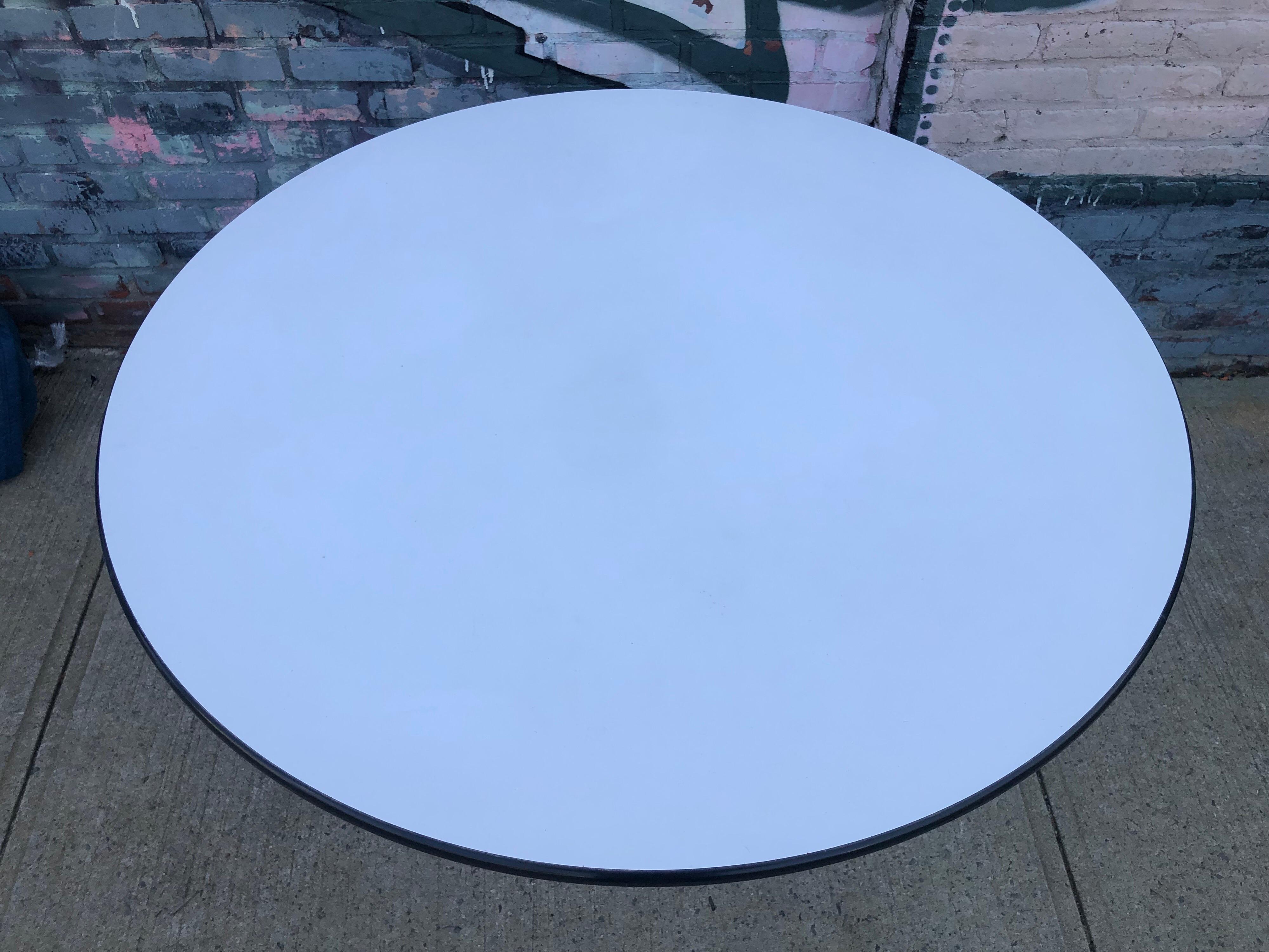 A large dining table produced by Herman Miller and designed by Charles and Ray Eames. This table features the early five star base which was also used on the Eames lounge chair. Only produced this way for a few years, the bases later change to a