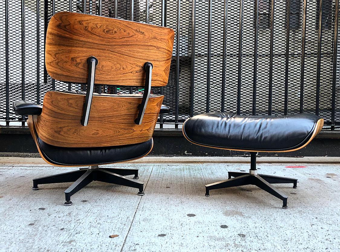 Gorgeous Eames chair and ottoman with vintage leather and gorgeous wood grains. The wood on this set is second to none, featuring lovely figures patterns with no uneven color or damage. Normal wear for a vintage piece. Fit for immediate and regular