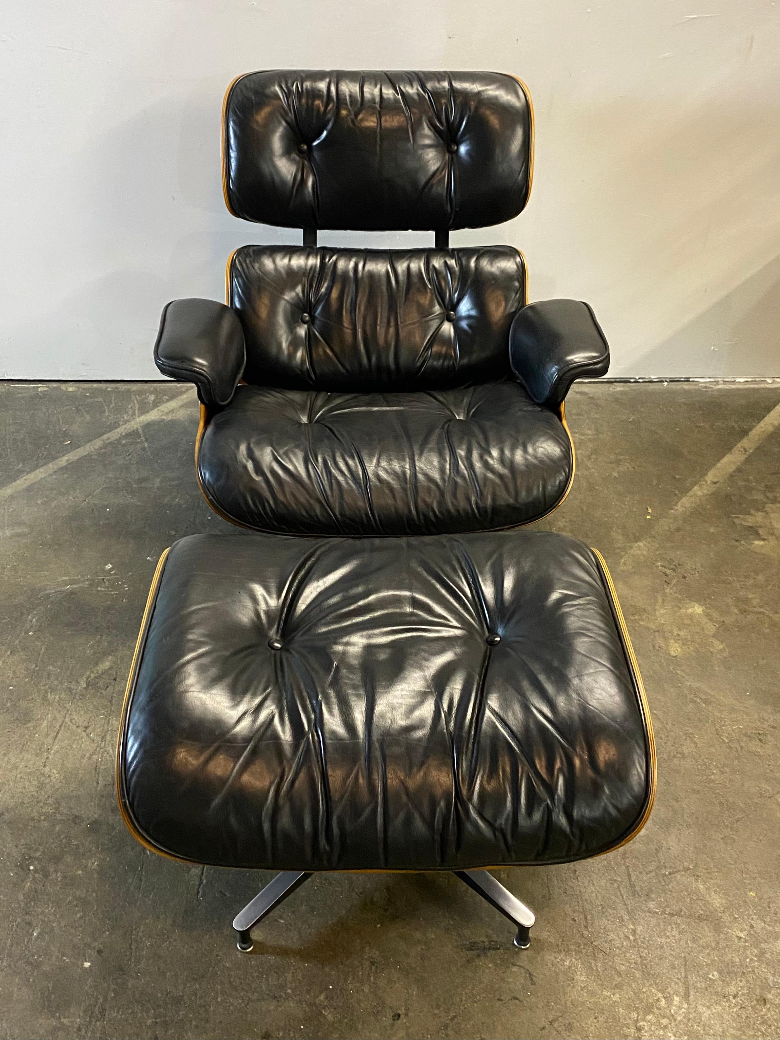 One of the best Eames lounge chairs we have come across in recent memory. Executed in original black leather and beautiful wood. This set features superb wood grain and color pattern on the exterior. Original leather in very good condition. Signed