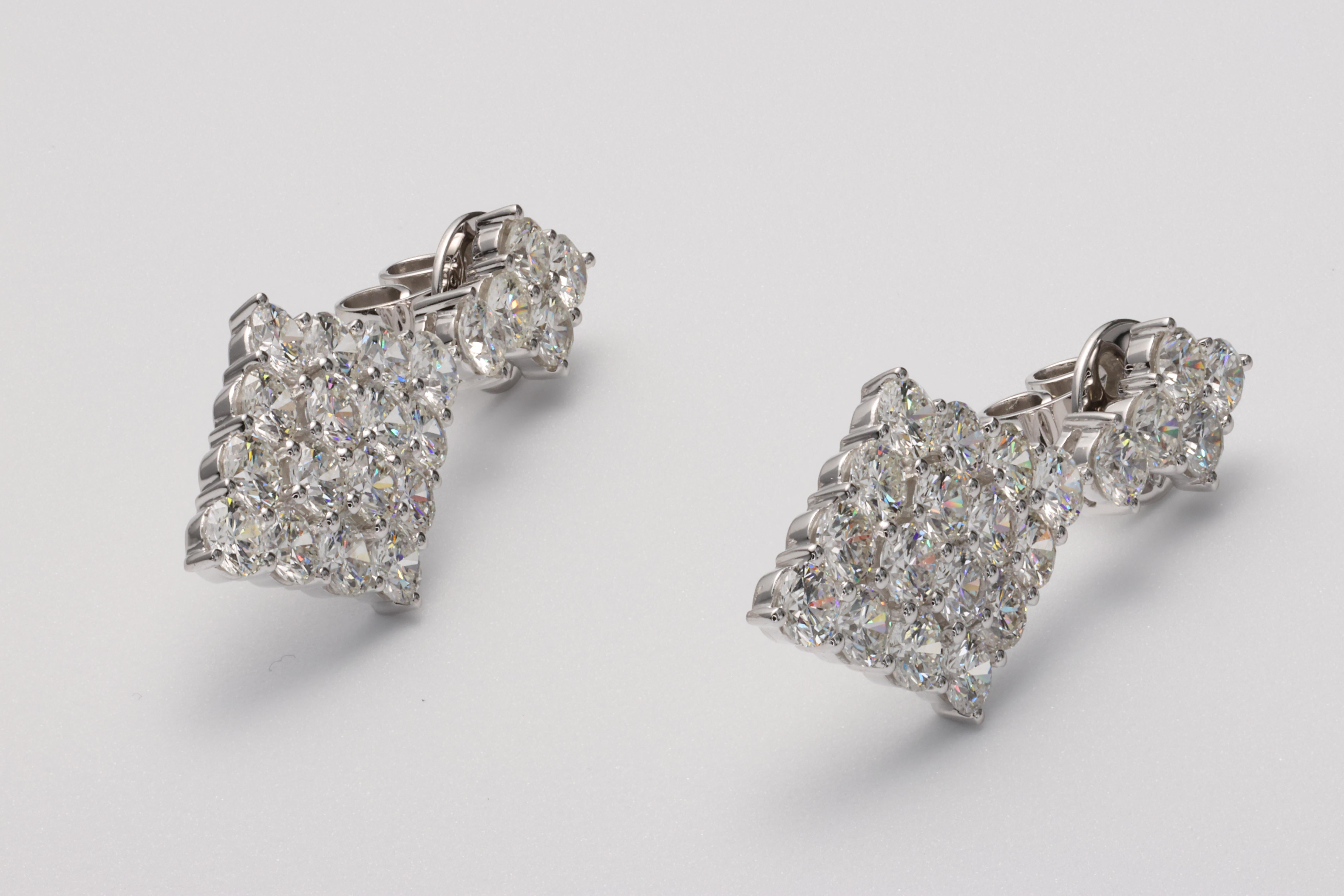 These beautiful kite shape drop earrings are set with approximately 6.22 carats of fine, precision cut and matched round brilliant diamonds that grab attention from across the room. 

The diamonds are F-H in color and VVS-VS clarities with fine