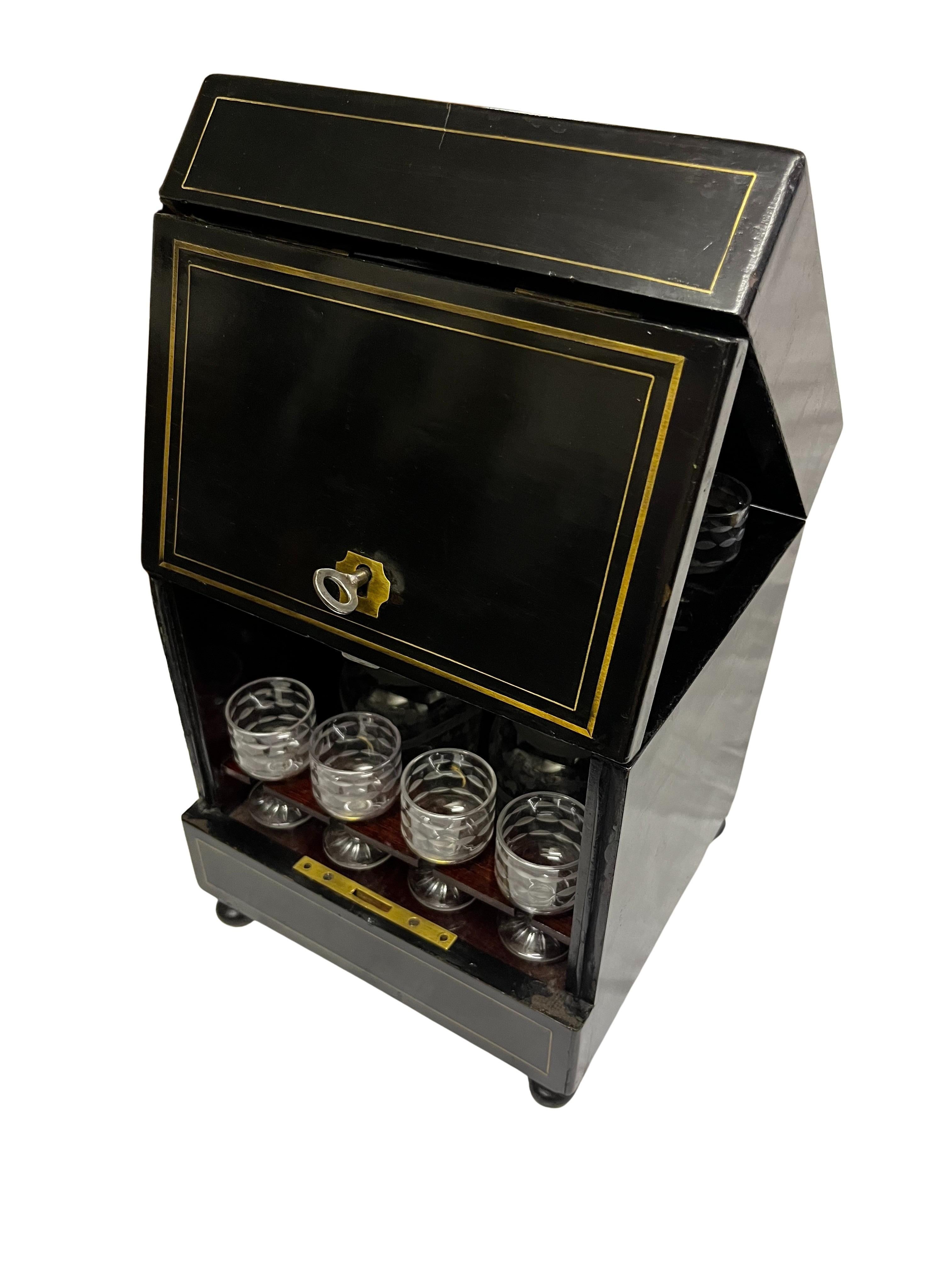 Accompanied by the original glassware, this exquisite liquor chest embodies the opulence and sophistication of the era. The liquor box is an original from the Napoleon III time, made around 1870/80. 

With an elaborate outside of ebonized wood with