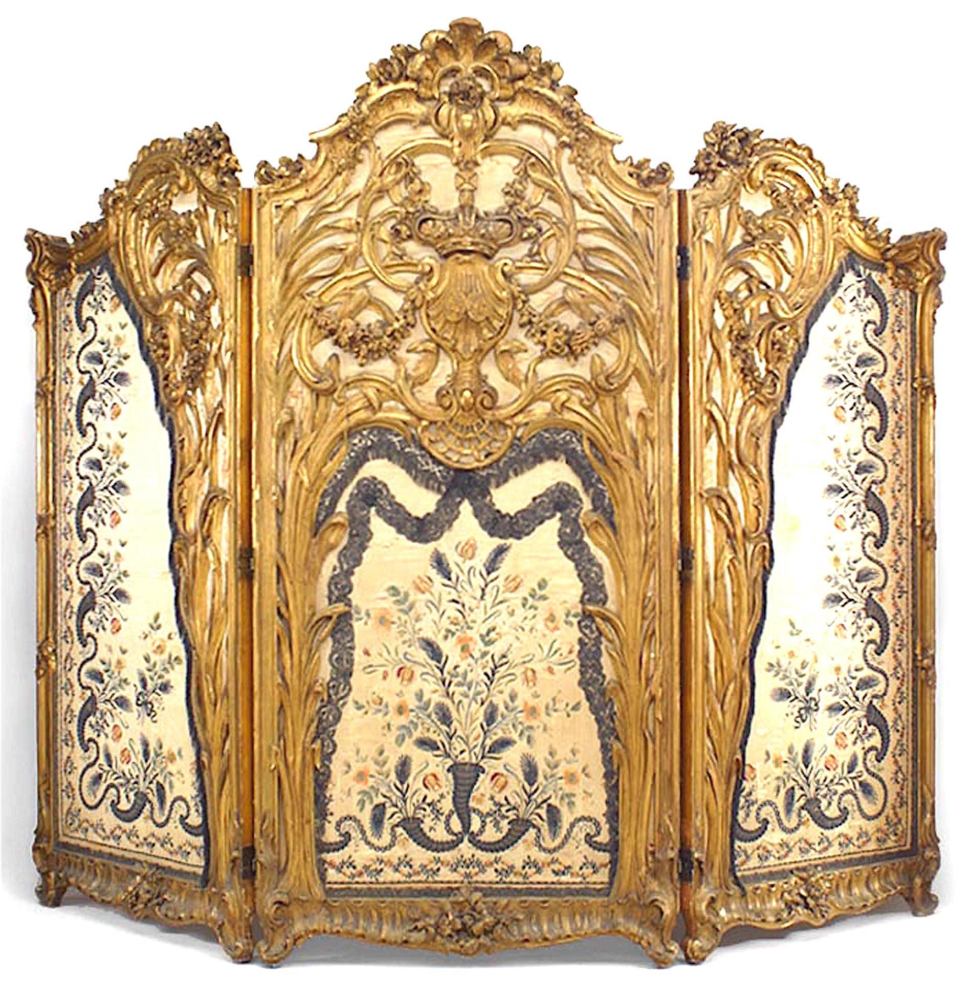 French Louis XV style (19th Century) carved gilt 3 fold screen with blue silk embroidered panels and cornucopia design.
