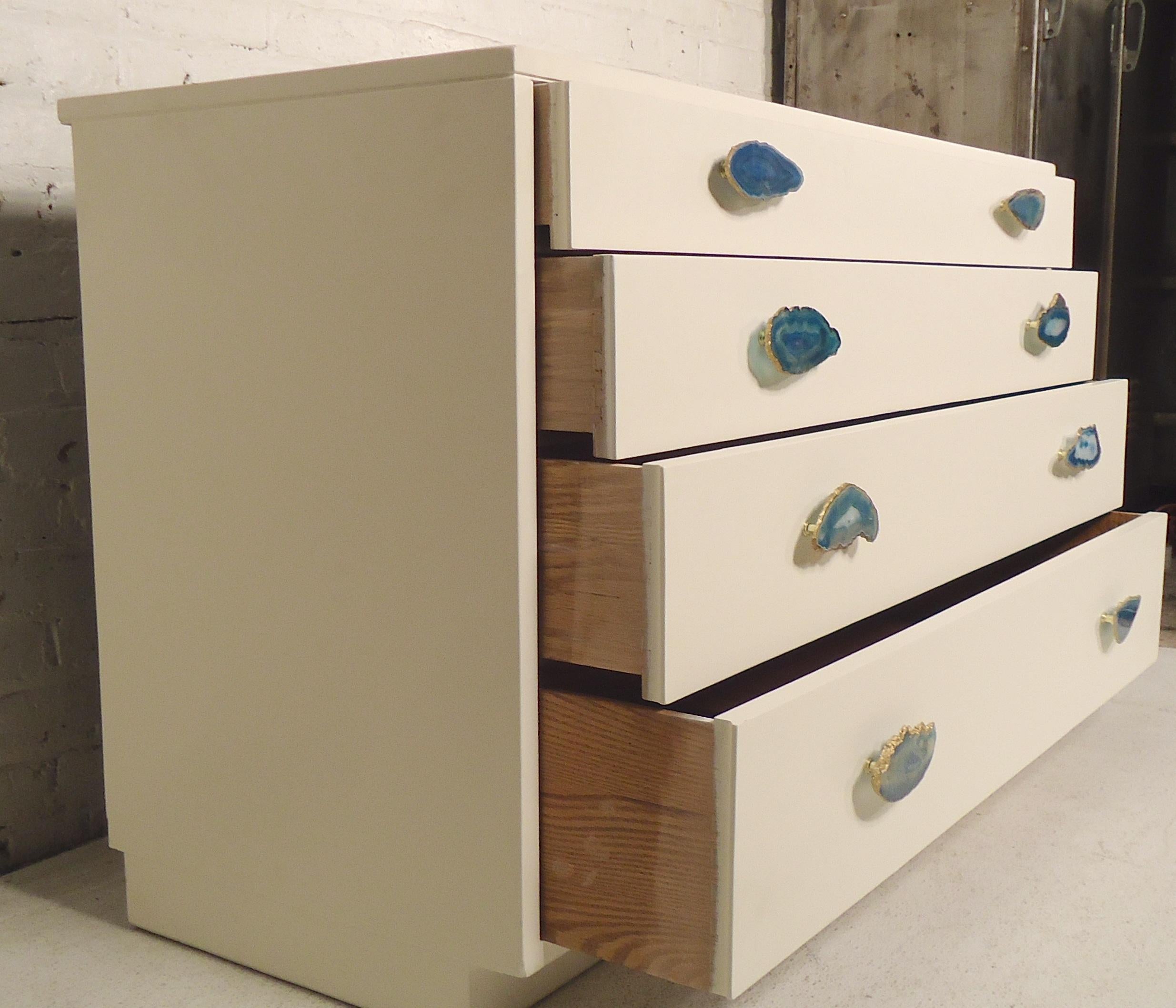 White lacquered chest of drawers with agate handles with gold colored trim. Simple but stunning design by the Johnson Furniture Company, retailed by John Stuart.

(Please confirm item location - NY or NJ - with dealer).
 