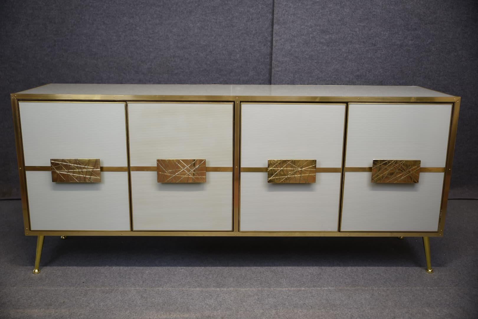 A stunning modern sideboard with white Murano “Grisinato” glass that showcases exceptional Italian craftsmanship and mid-century modern style.

This handcrafted sideboard is made of birch wood and features four white “Grissinato” Murano glass