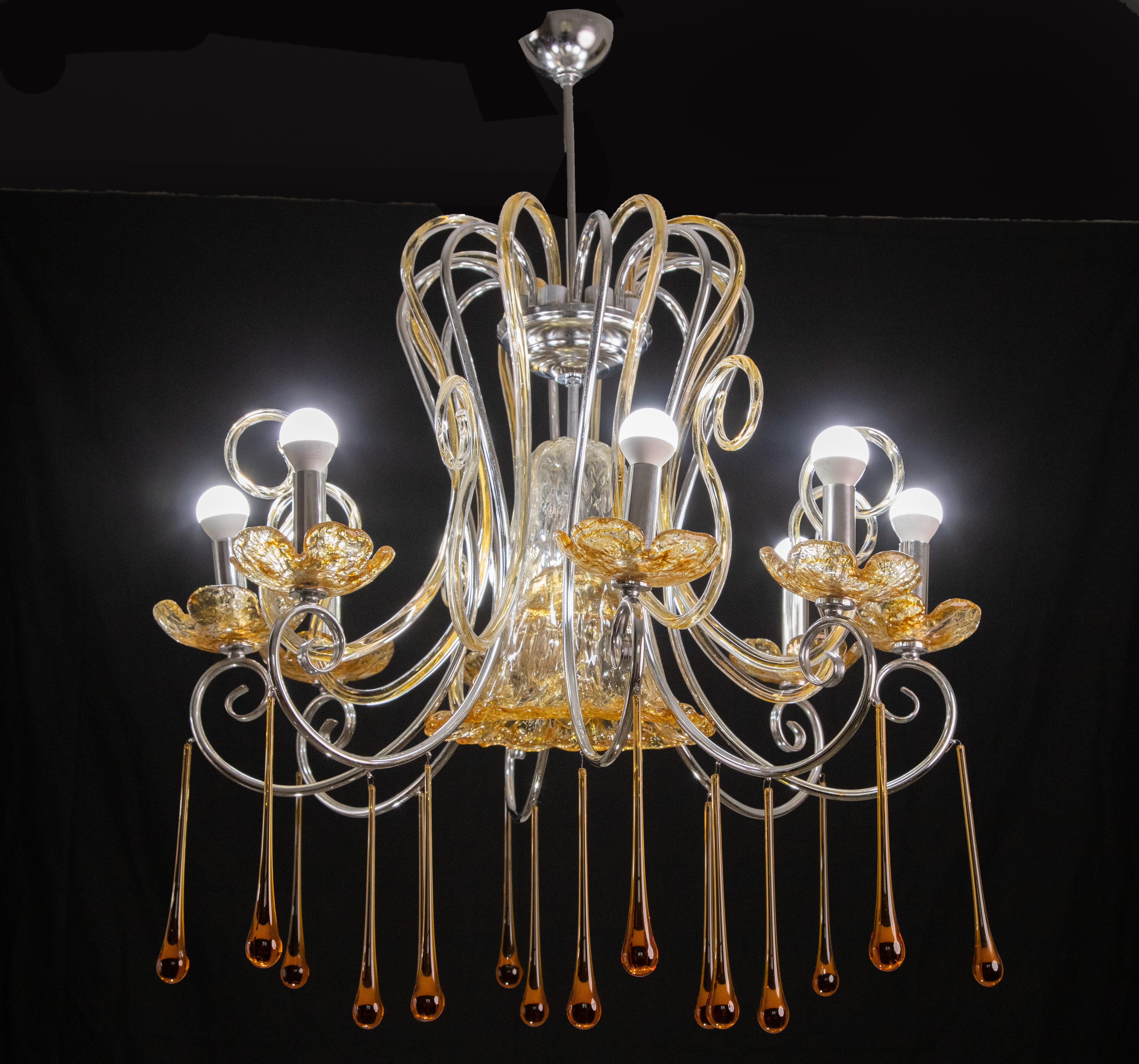 Spectacular Murano chandelier filled with glass elements.

The chandelier mounts 8 lights e14 European standard.

It measures 100 centimeters in height and 70 in diameter.