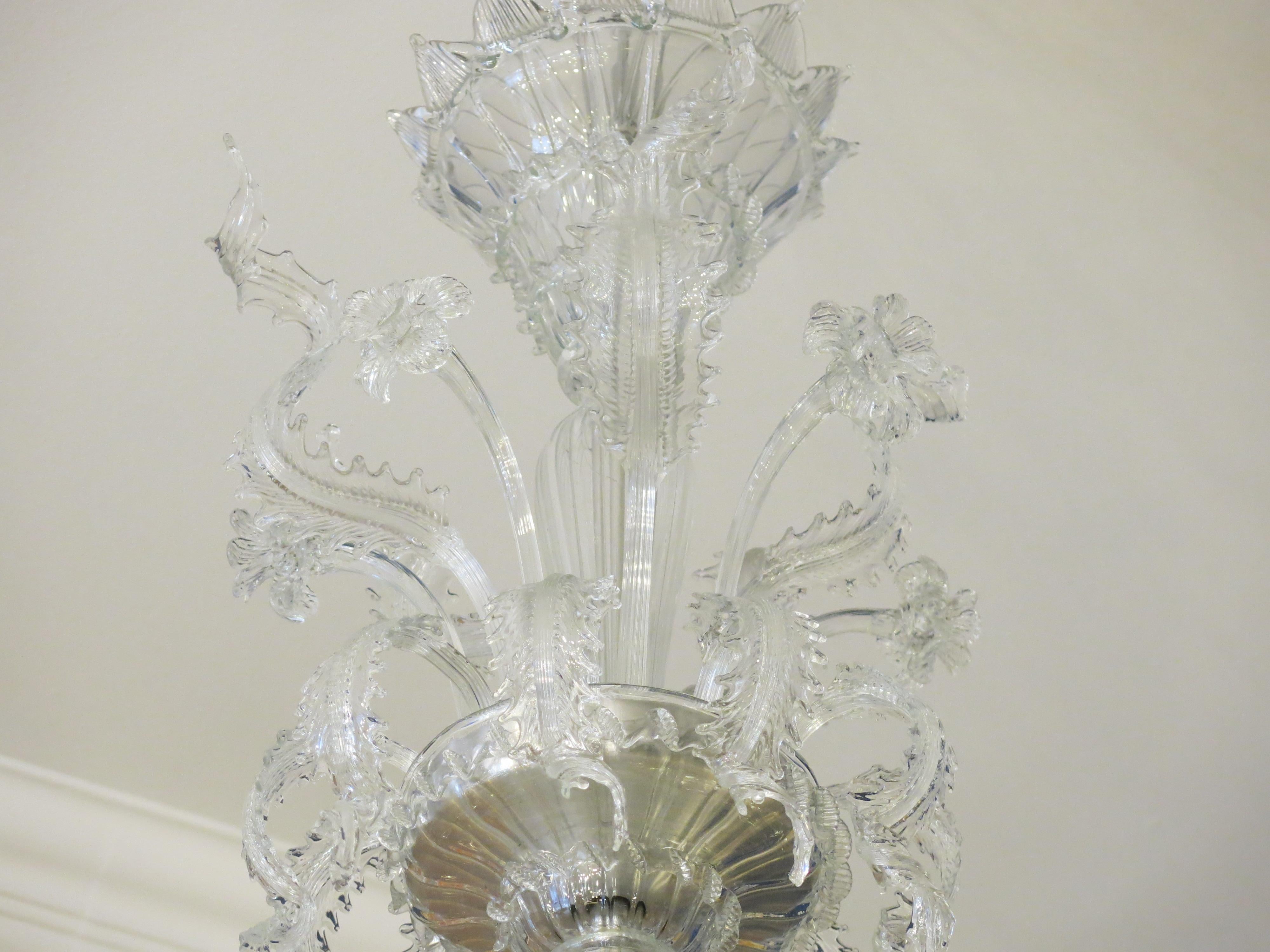 Introducing a magnificent Murano chandelier crafted by the renowned Archimede Seguso during the years 1960-1965. This exquisite piece embodies the epitome of Murano glass craftsmanship, showcasing Seguso's mastery of glass artistry. In excellent
