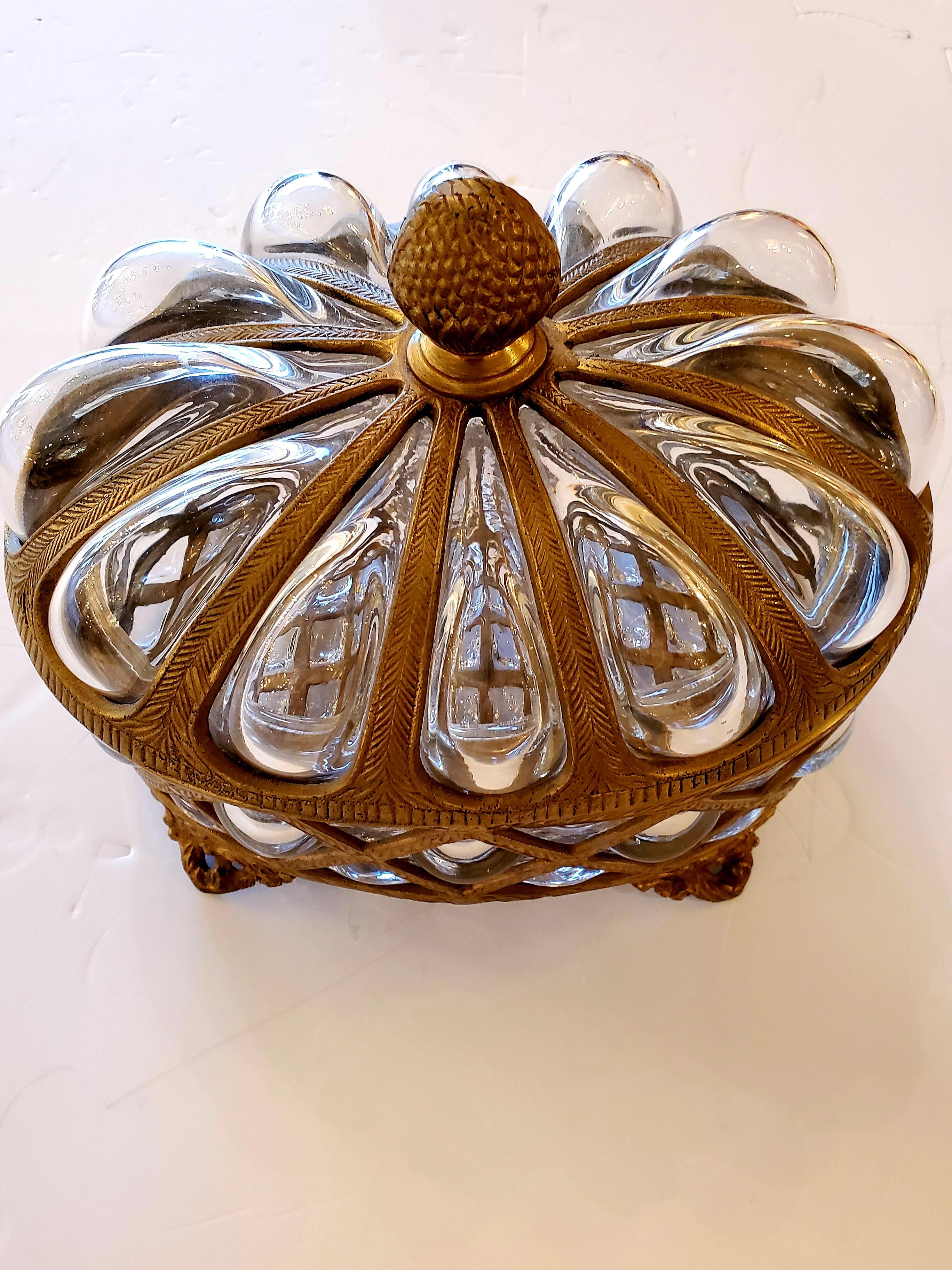 Prettiest box ever having murano glass and brass with bubbles of delicious glass oozing up from the lid and detailed brass structure including acorn finial on top and lovely feet.