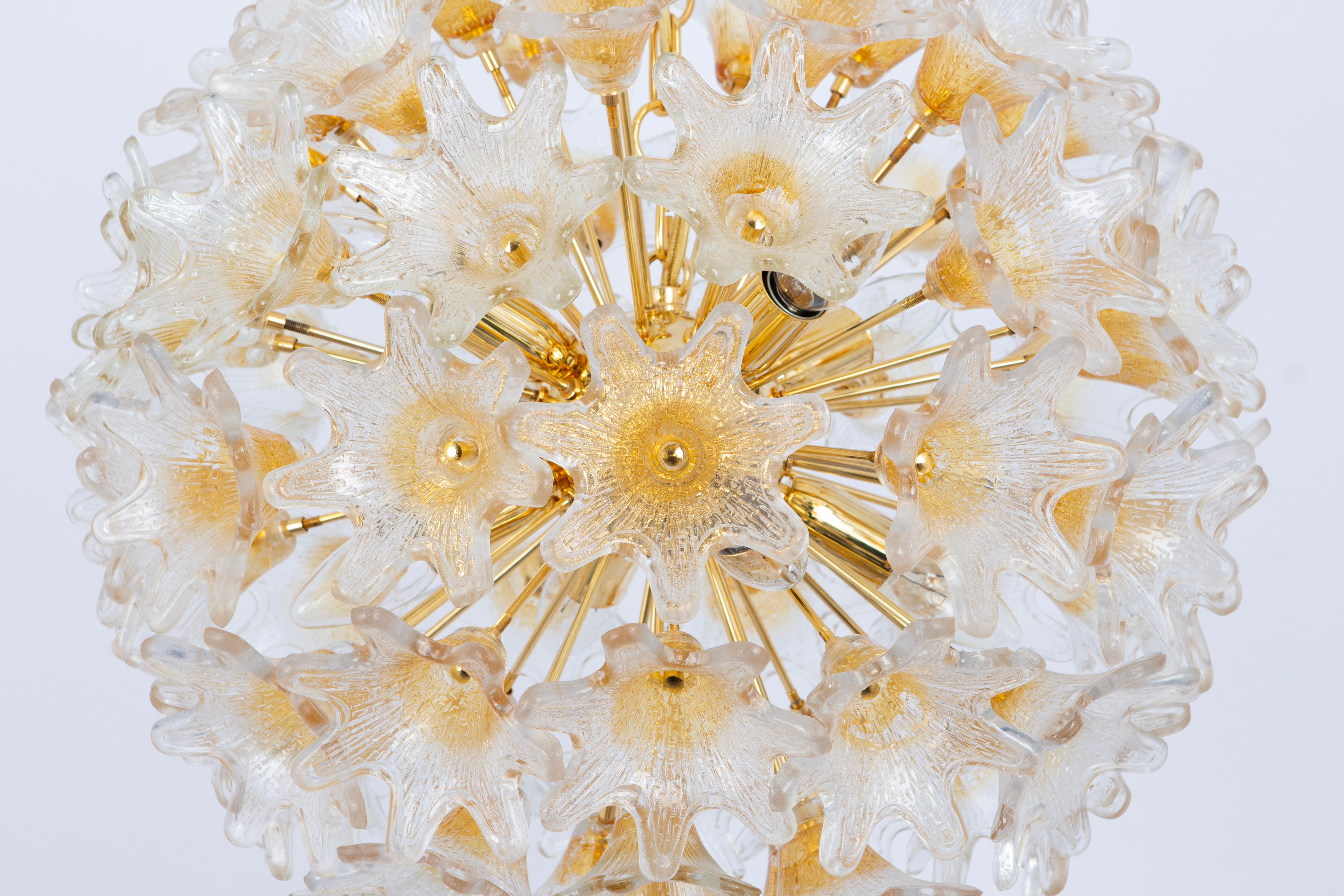 Spectacular Murano glass and brass sunburst flower chandelier by Venini for VeArt, Italy 1970s
Stunning shape and a great light effect.
All glasses are in good condition.
It needs 8 small-size bulbs (E-14 bulbs) up to 40 watts.
Light bulbs are not