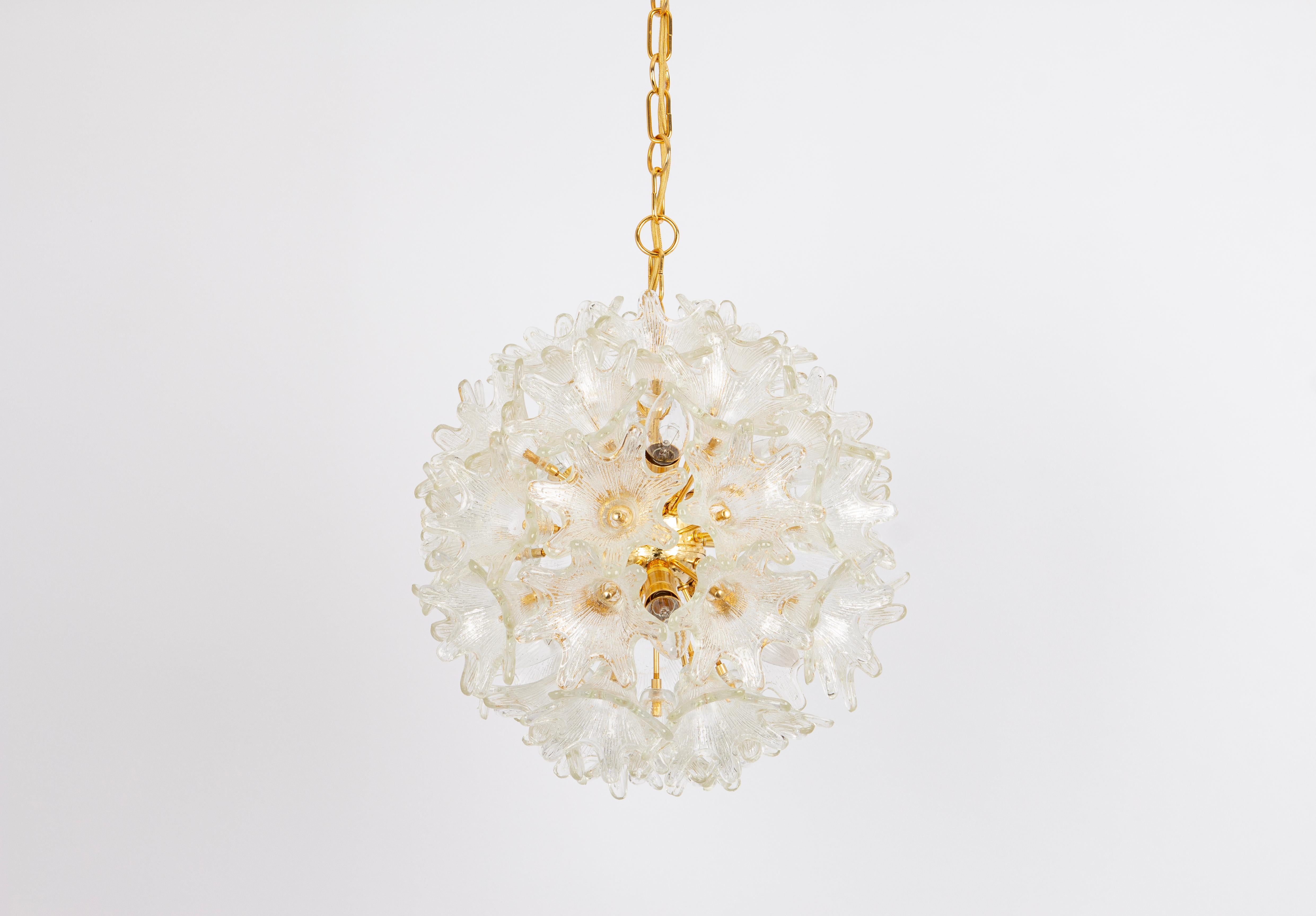 Spectacular Murano glass and brass sunburst flower chandelier by Venini for VeArt, Italy 1970s
Stunning shape and a great light effect.
All glasses are in good condition.
It needs six small-size bulbs (E-14 bulbs) up to 40 watts.
Light bulbs are not