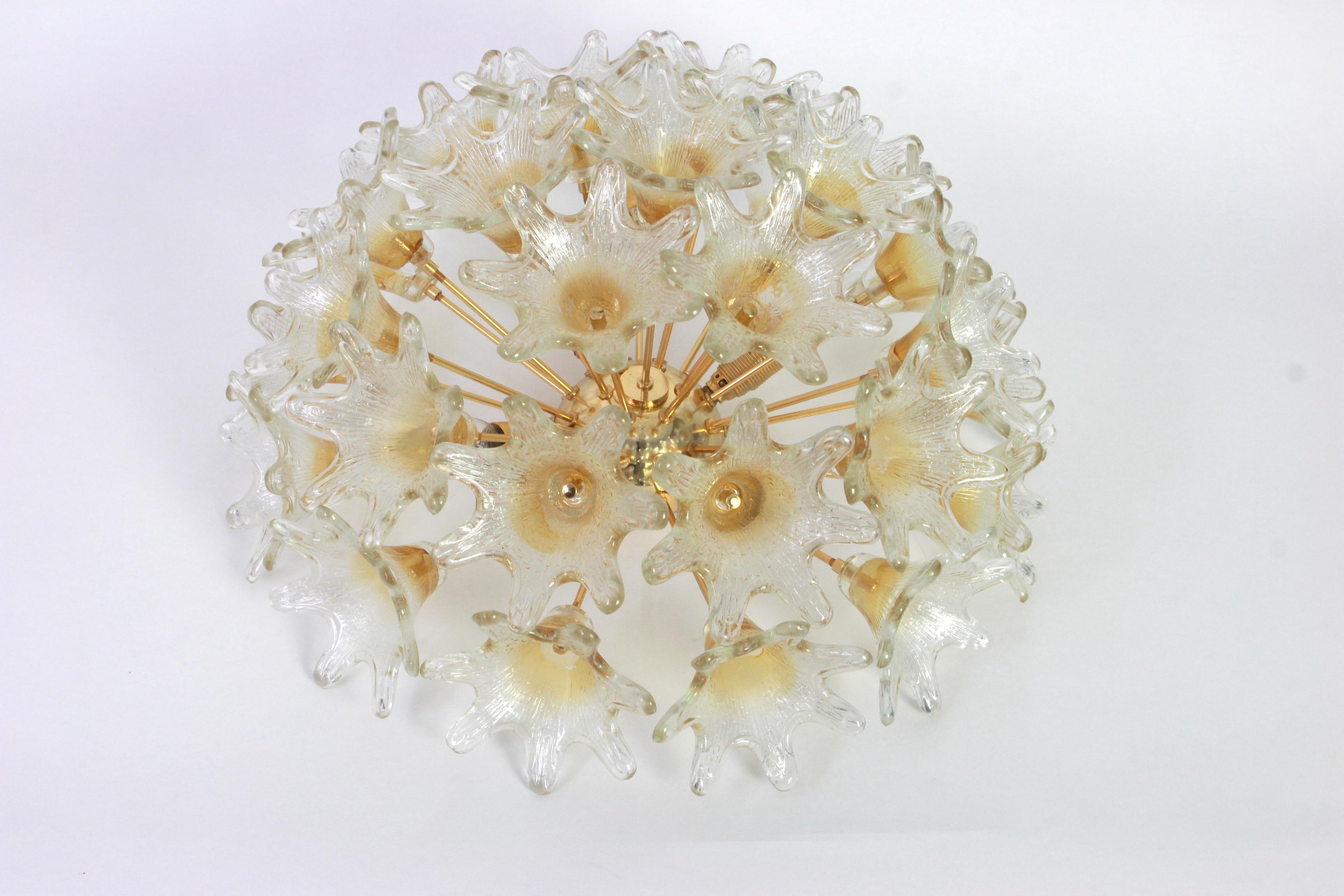 Spectacular Murano glass and brass sunburst flower flush mount by Venini for VeArt, Italy 1970s
Stunning shape and great light effect.
All glasses are in good condition.
It needs 4 small size bulbs (E-14 bulbs) up to 40 watts each and is
