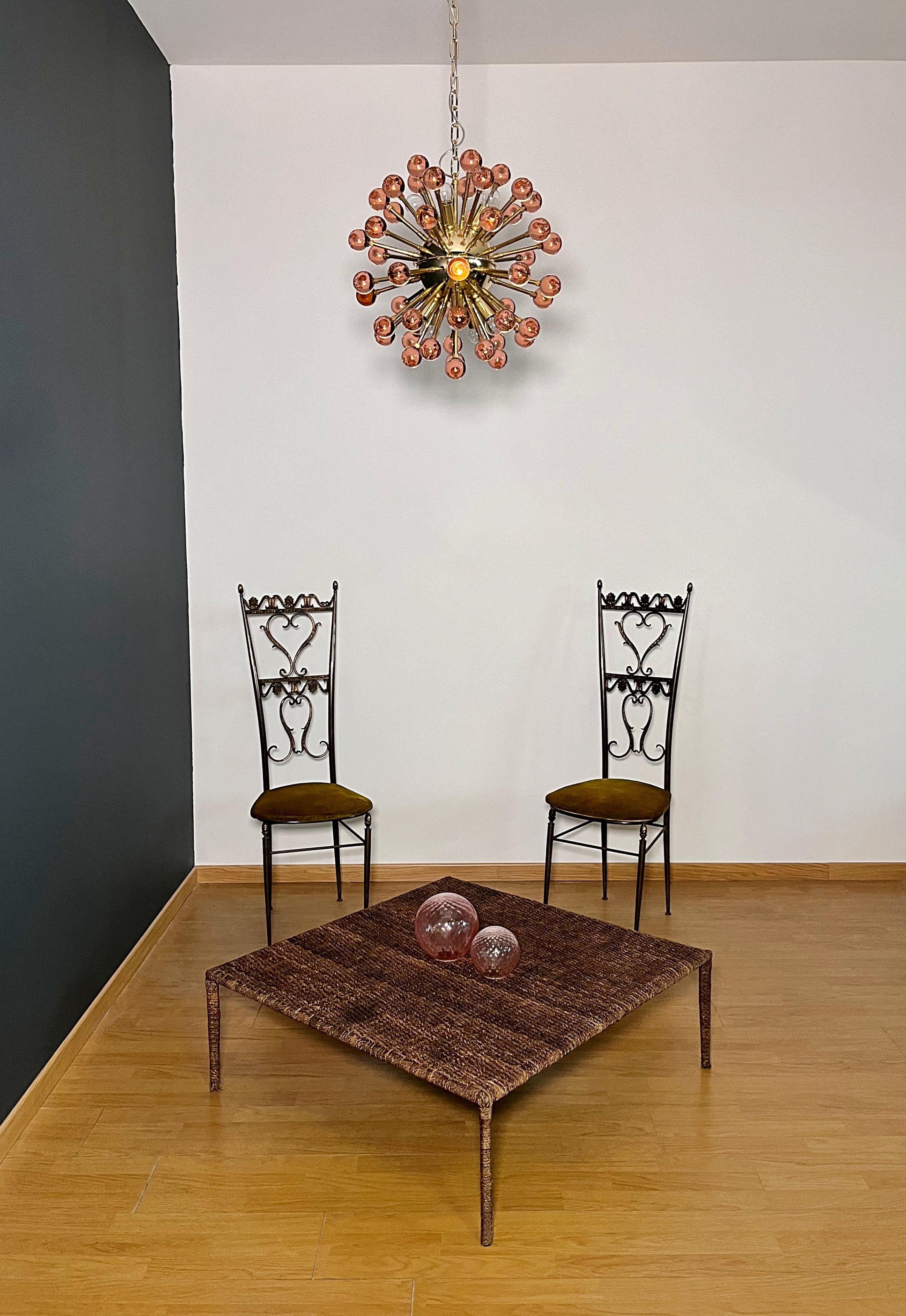 Italian Sputnik chandelier in brass plated metal frame, 51 rare pink solid glass spheres. Murano blown glass in a traditional way. 10 light points.
Weight of chandelier about 17 kg.
Period: late xx century
Dimensions: 44,50 inches (115 cm) height