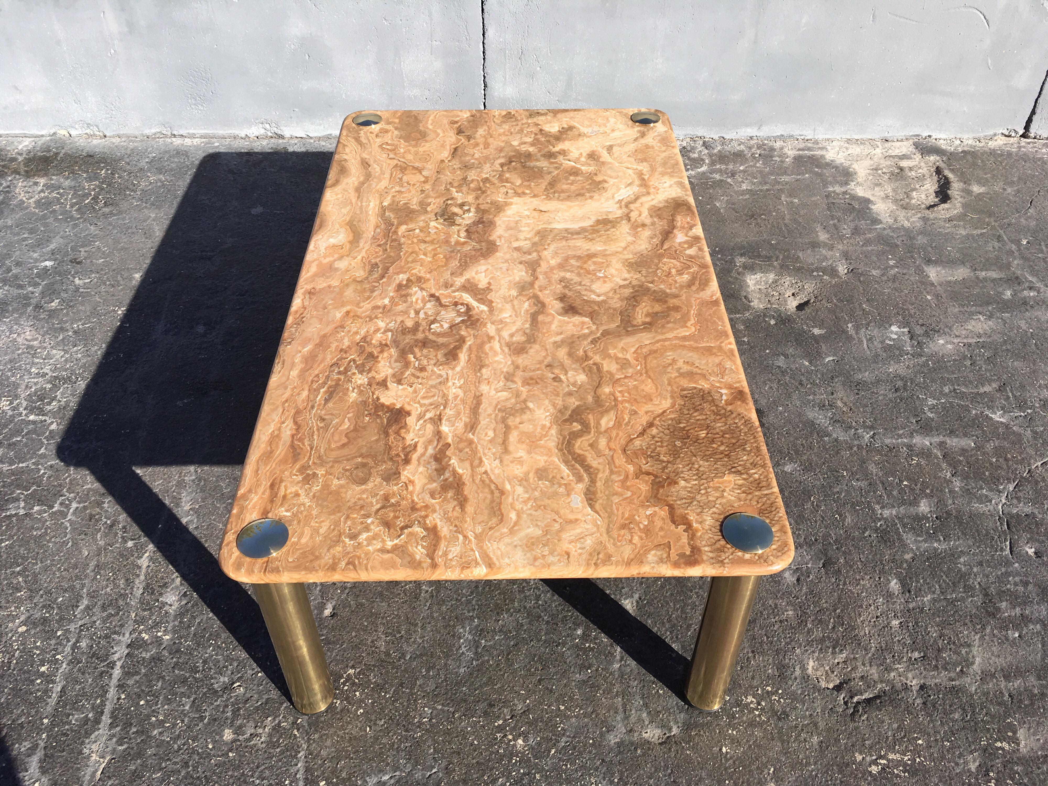 Rare onyx coffee table on brass legs. Made in Italy.