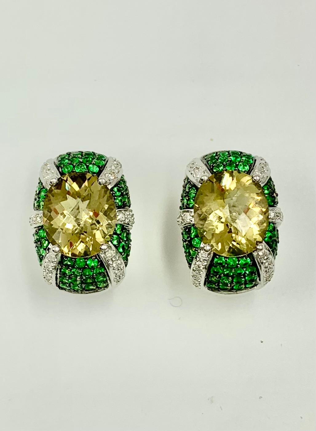 Fabulous, large and luxurious diamond, Tsavorite garnet and faceted Lemon quartz 14K white gold earrings
20th Century
Diamonds: H-I, VSI, .65 TCW
Tsavorite garnets: bright green, well matched
The central Lemon quartz gemstones measuring