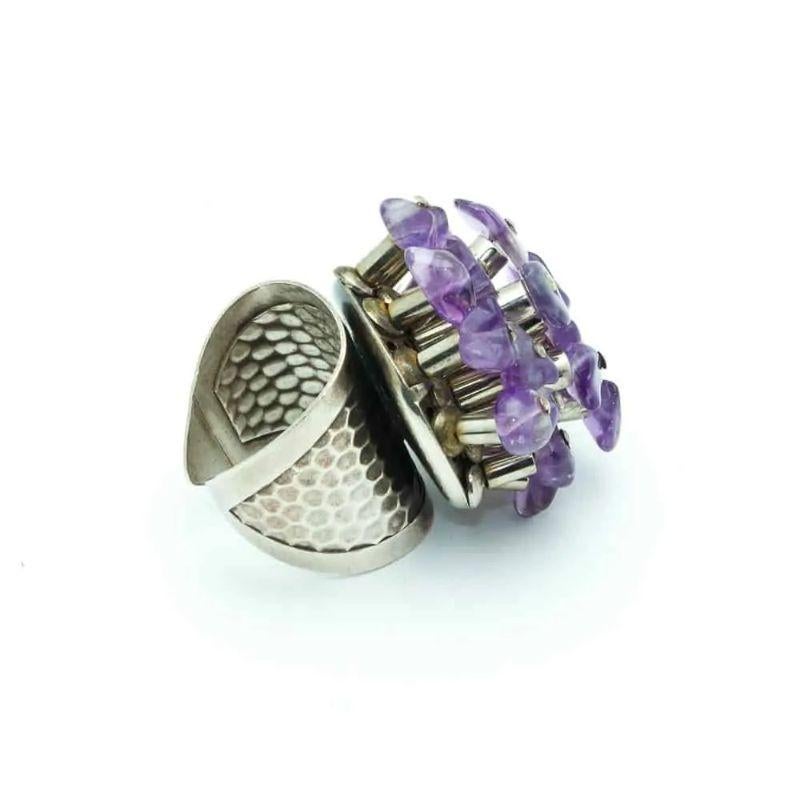 Huge, Rare and beautiful Paco Rabanne vintage ring, silver plafed metal and amethyst glass stones.

Signed: Paco Rabanne Paris
Dimensions: Adjustable size
Condition: Excellent vintage condition
