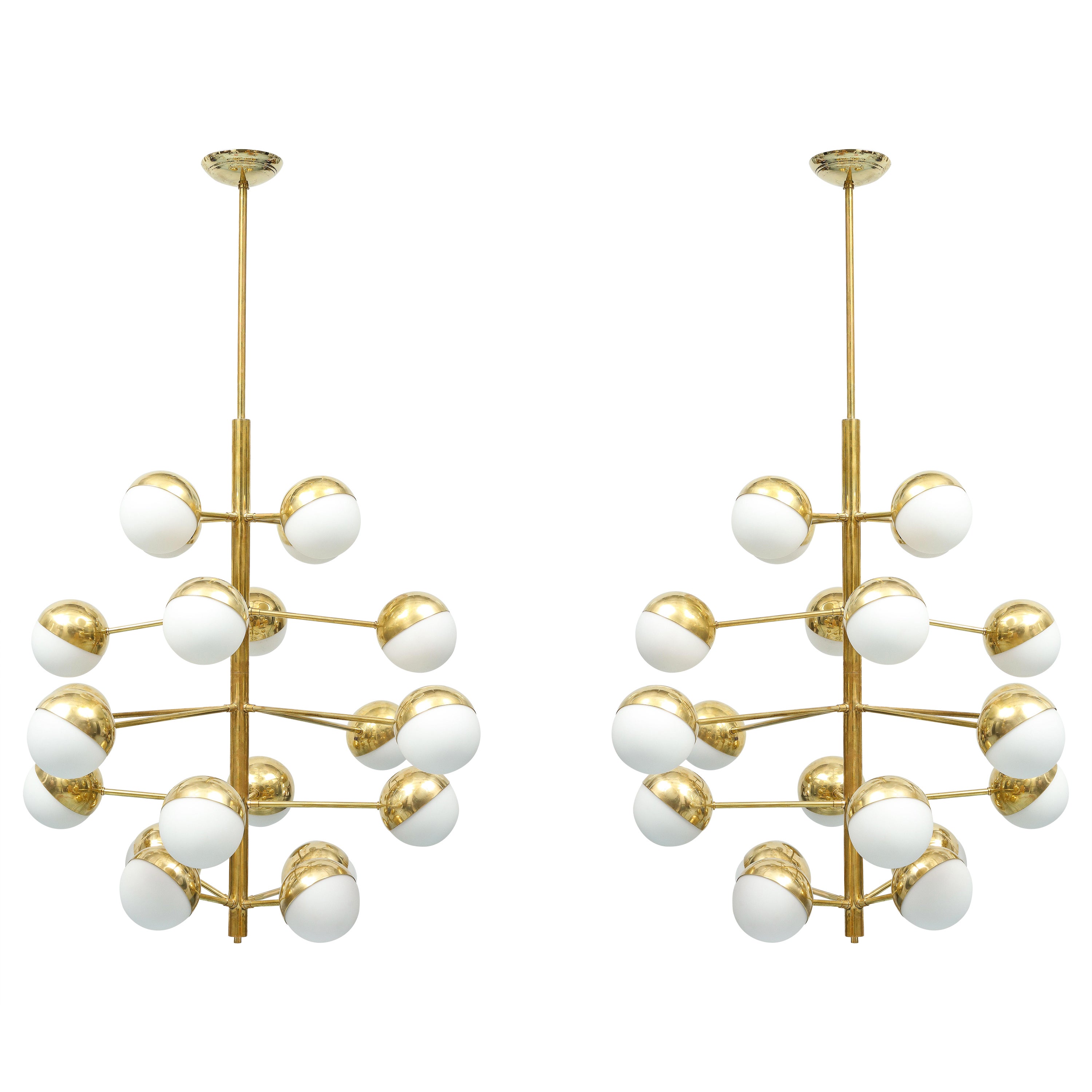 This is a rare pair of chandeliers. Each one has 20 lights American wired. Each globe is composed of a half sphere in brass and opaline. The canopies were added and the brass professionally refinished. 