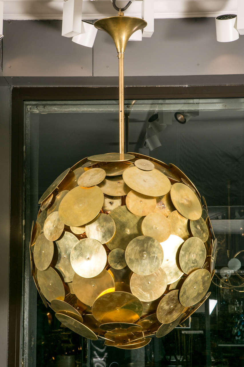 Pair of chandeliers composed of brass discs from different sizes in bowl shape, 40 lights of 40 W per lights.
possibility custom size 
price for 1.