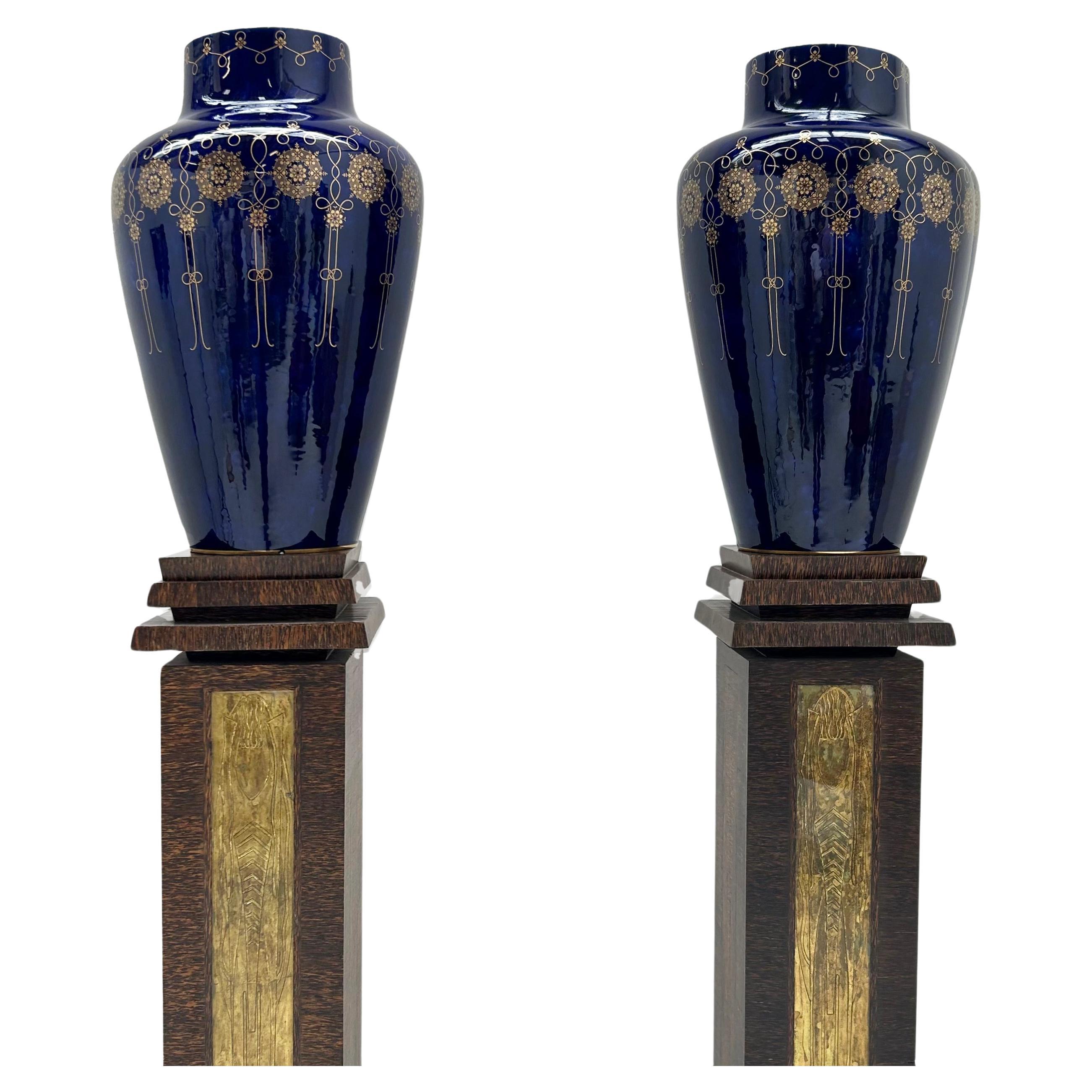 National de Sèvres factory 
Pair of porcelain vases with blue background and gilded rosette decoration marked and dated 1903 and 1908 decoration 
H: 65.5 cm and H: 67 cm. diameter 40 cm
3 shards at the base of a vase, original hollowed-out bottoms