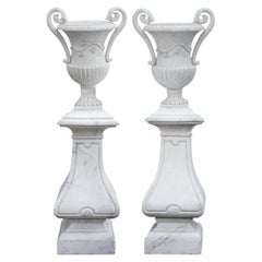 Spectacular Pair of White Marble Classic Form Handled Urns w/ Baluster Pedestals