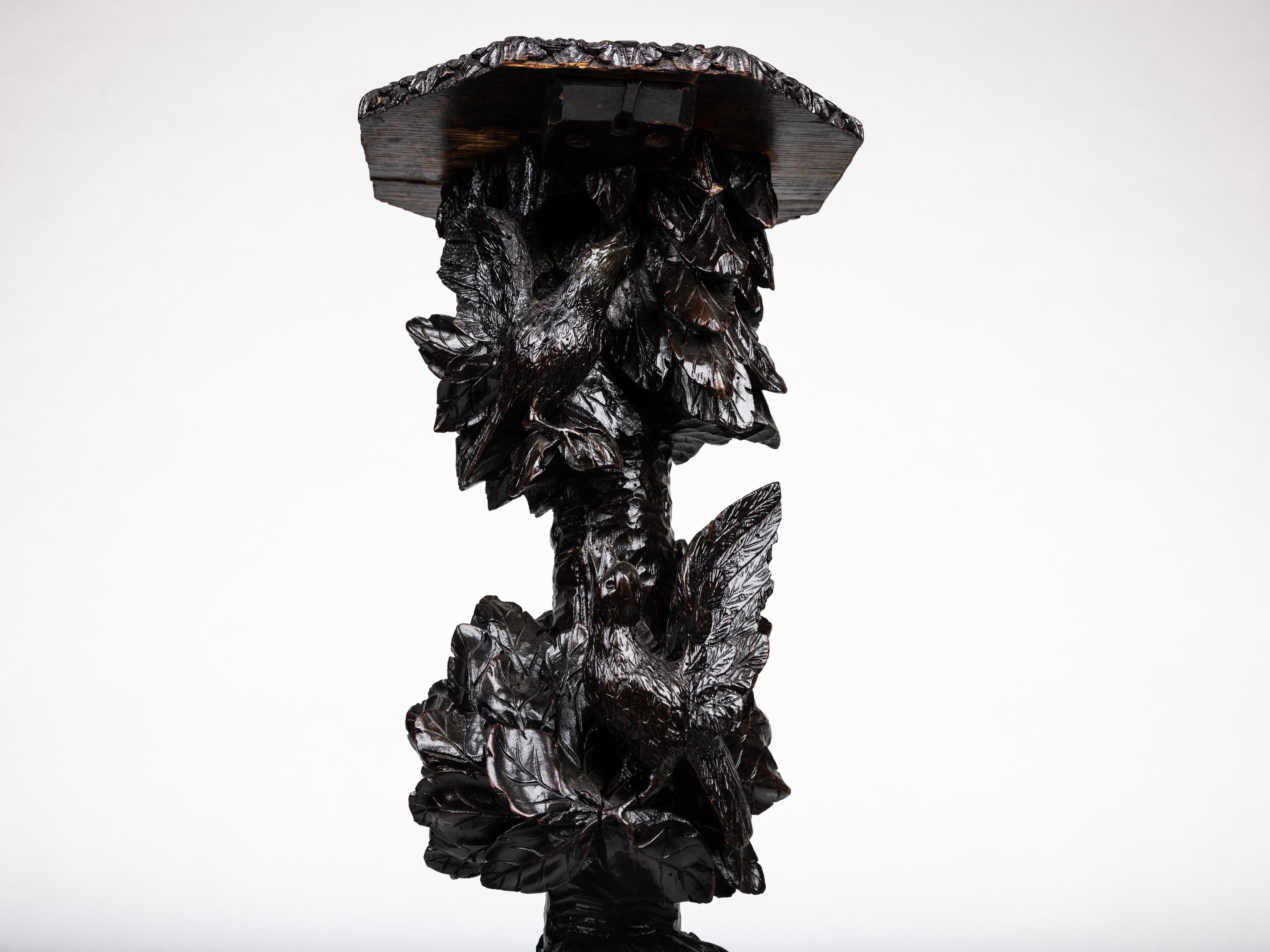 Incredibly special pedestal, made in the late 19. century, around 1880 in Austria or Bavaria, in typical Schwarzwald - Black Forest decor / Tramp Art. 

The column is made from wood that has been stained to a dark shade. The entire column is richly