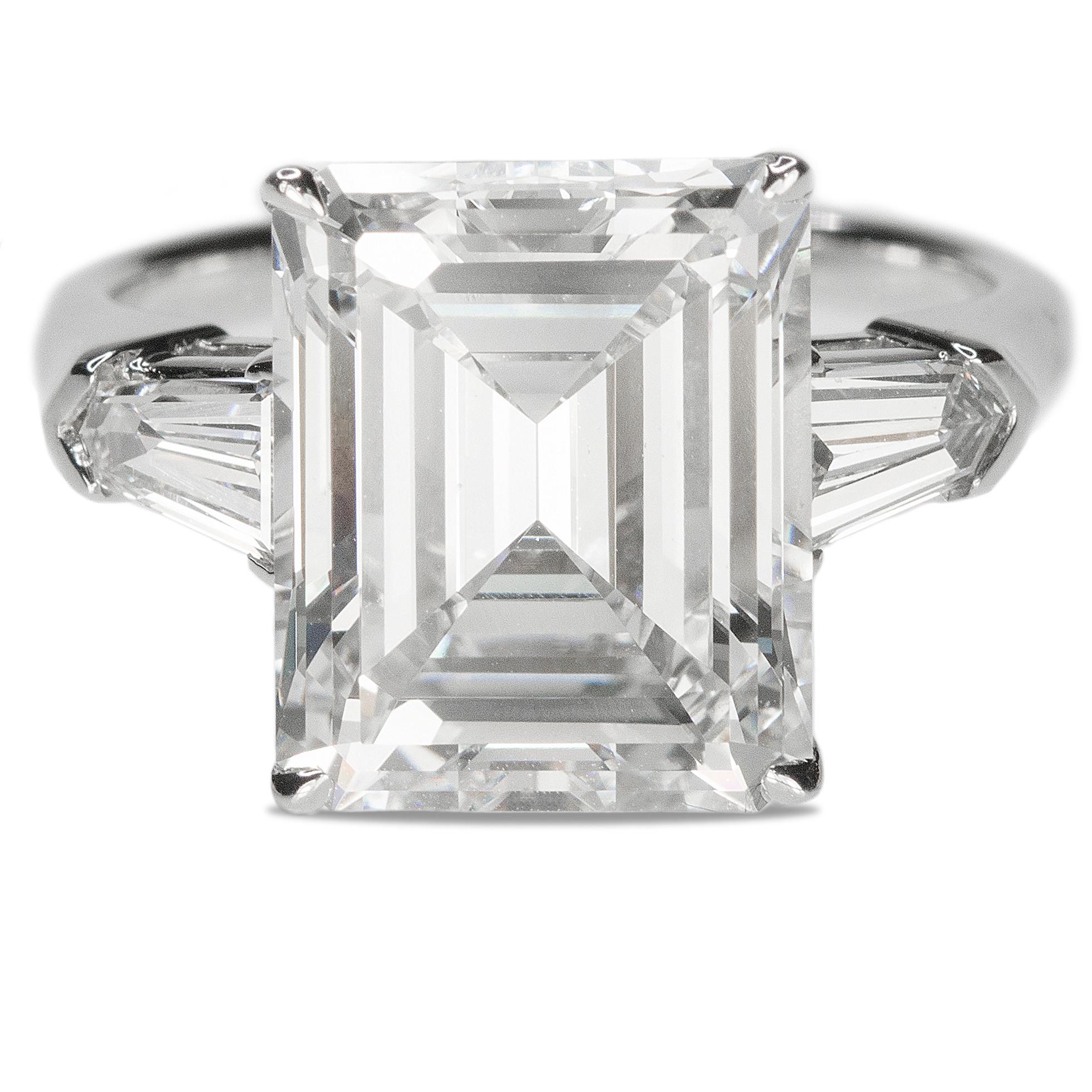 Absolutely the most beautifully emerald cut diamond ring on the market. This perfectly cut 5.01 carat emerald cut is graded by GIA as an H color VS2 clarity and is 100% eye clean. Set in a platinum mounting with two bullet shape side stones weighing