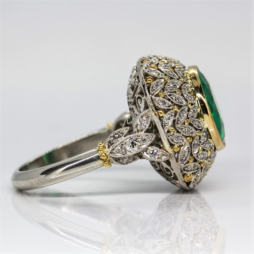 This one of a kind ring displays one unique natural emerald GIA CERTIFIED MINOR 2.98ctw set in an 18k gold frame.
Handmade in solid platinum, the leaves shape design decorated with 18k gold is set with 86 old mine cut diamonds of I-SI1 quality that