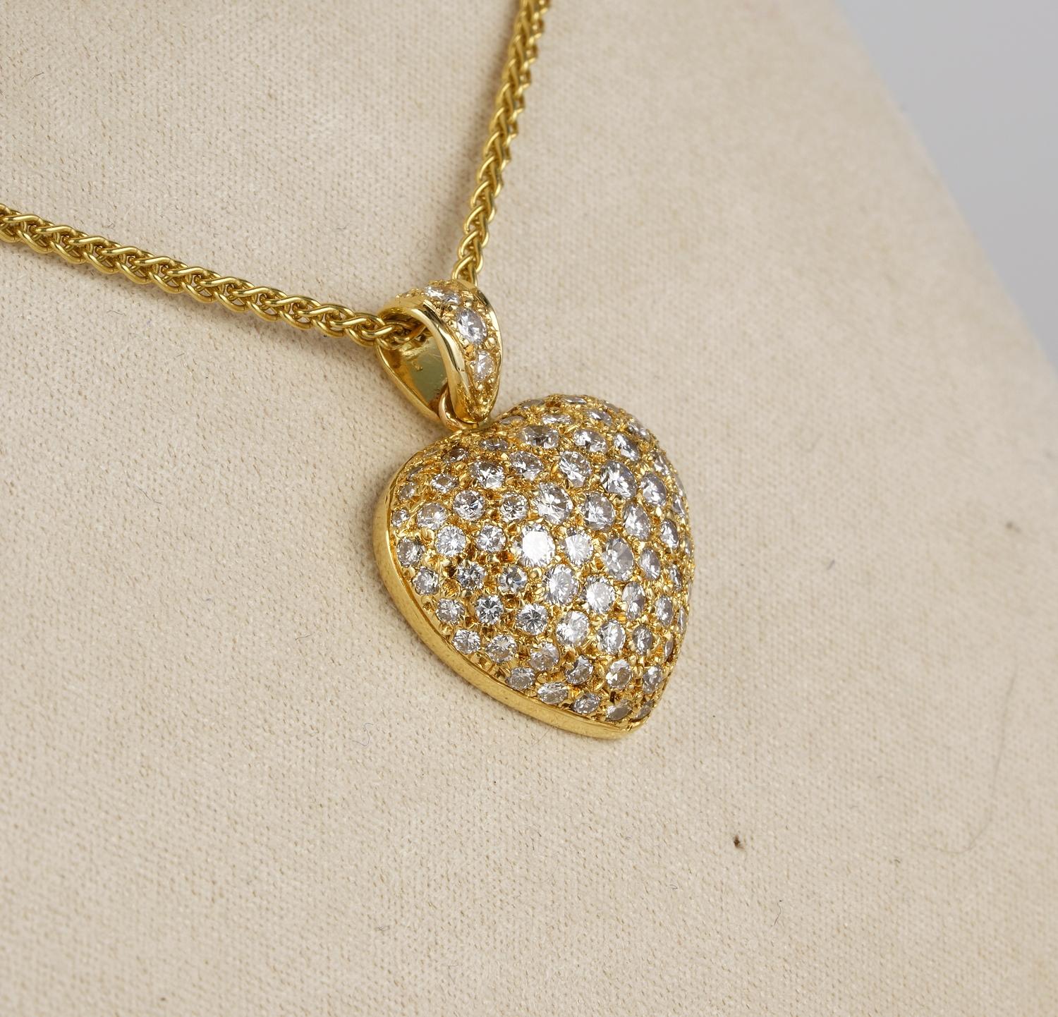 Love Connection

Extremely fine vintage, Diamond heart pendant in a charming puffy shape literally overwhelmed by loads of round brilliant cut Diamonds of the finest quality
French Origin 1960 ca – 
Beautiful size to display on the neck, infinite